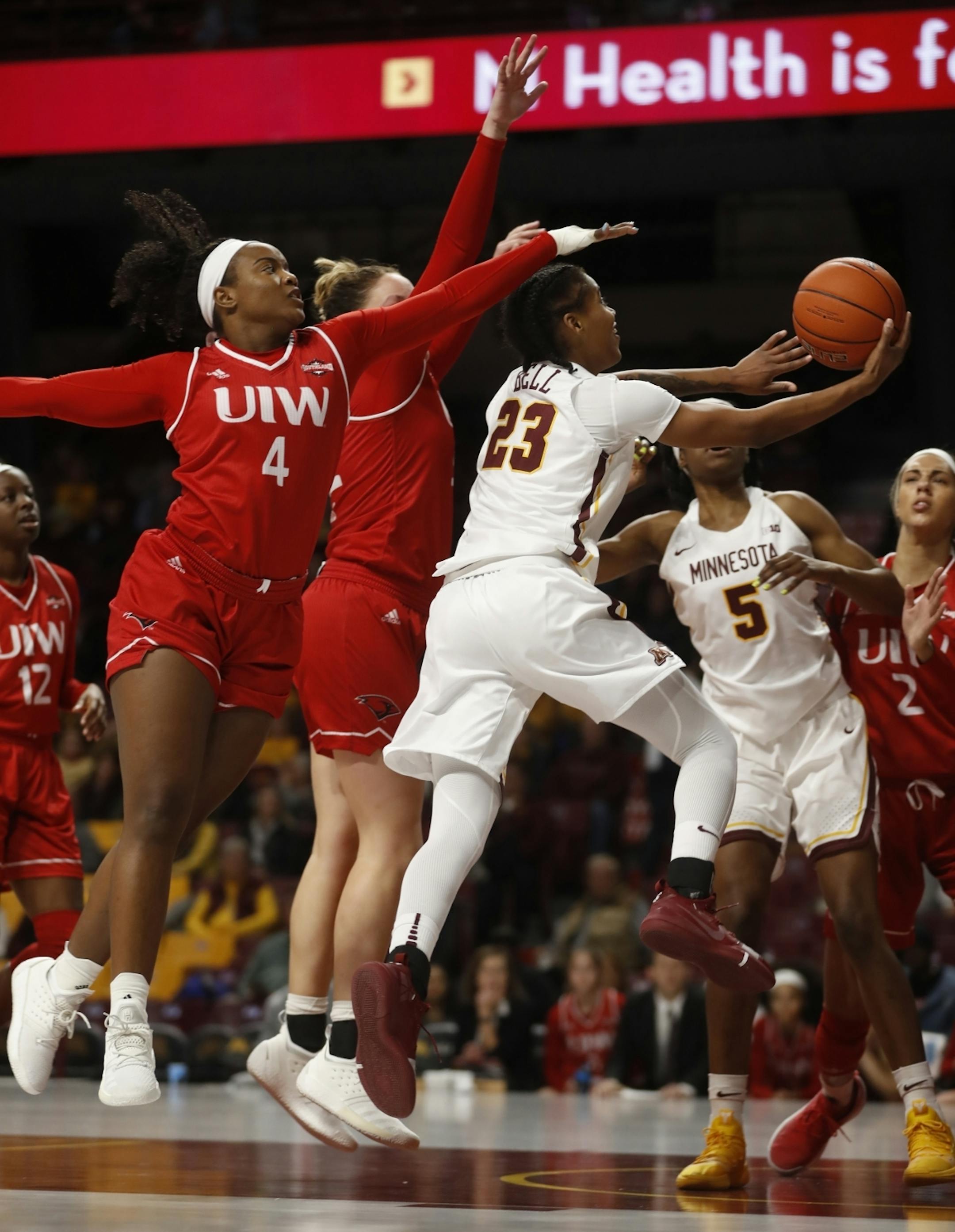 Kenisha Bell(23) splits the defense including blowing by Gabbie Bowie(4).