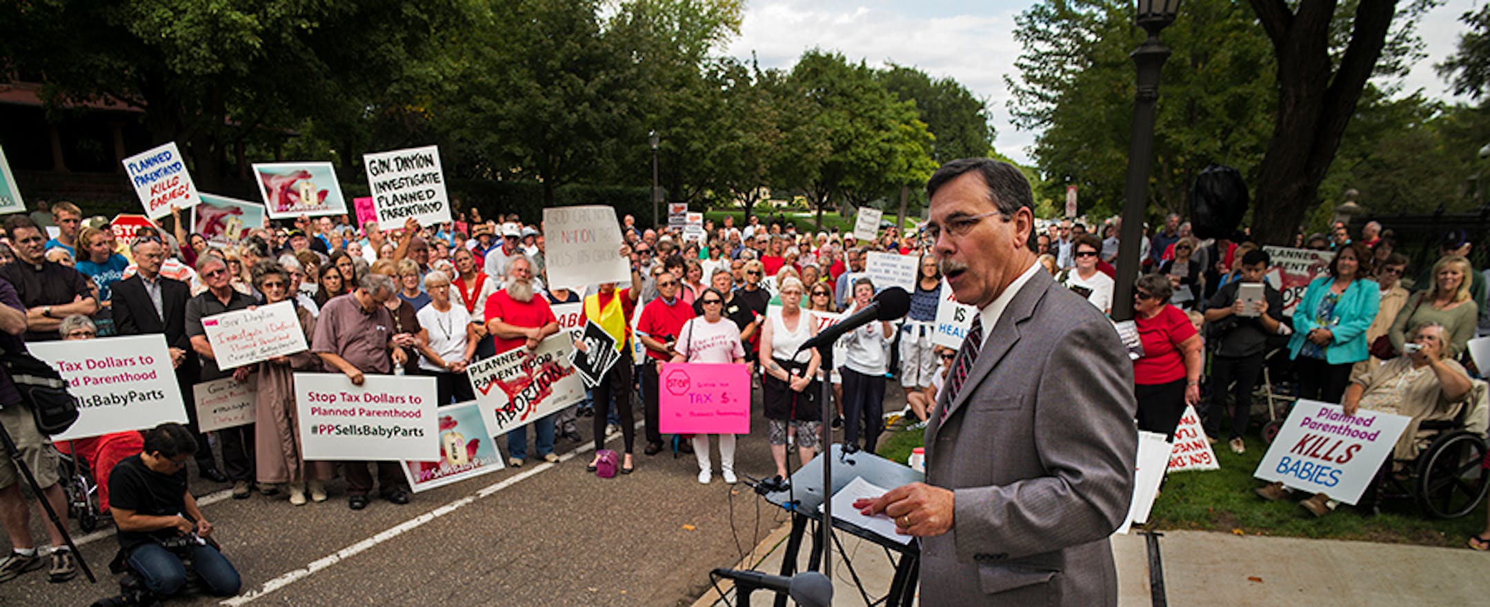 In front of the governor's mansion in St. Paul, pro-life activists gathered to ask Gov. Mark Dayton to investigate Planned Parenthood and calling for legislators to defund the organization. Brian Gibson, executive director of Pro-Life Action Ministries was leading the crowd of over 500.