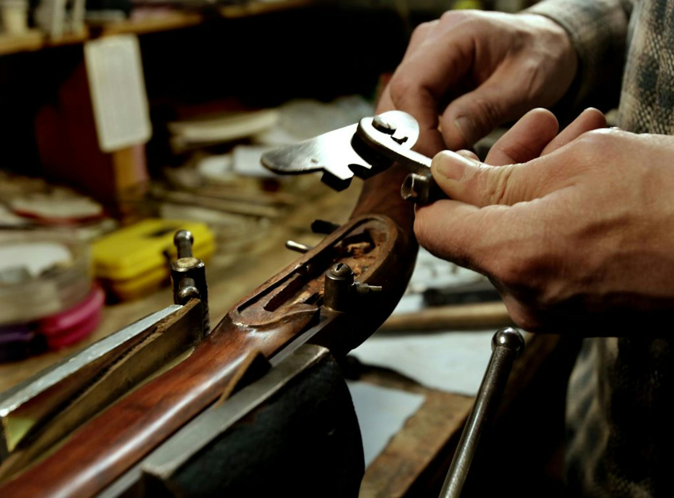 Bill Young works on a muzzleloader in his workshop.