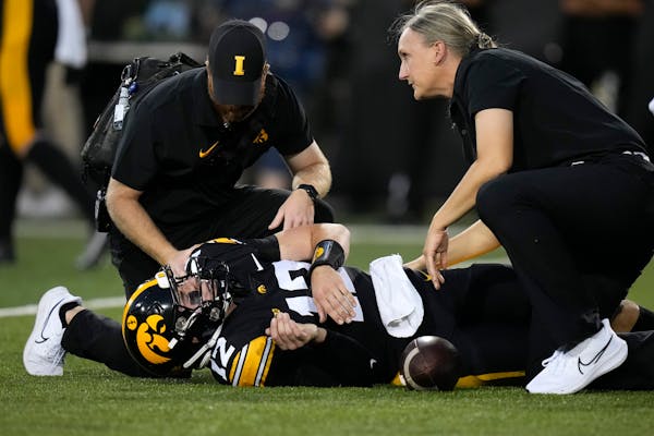 Iowa quarterback Cade McNamara suffered a knee injury in the first half of Saturday night’s victory against Michigan State and did not return to the