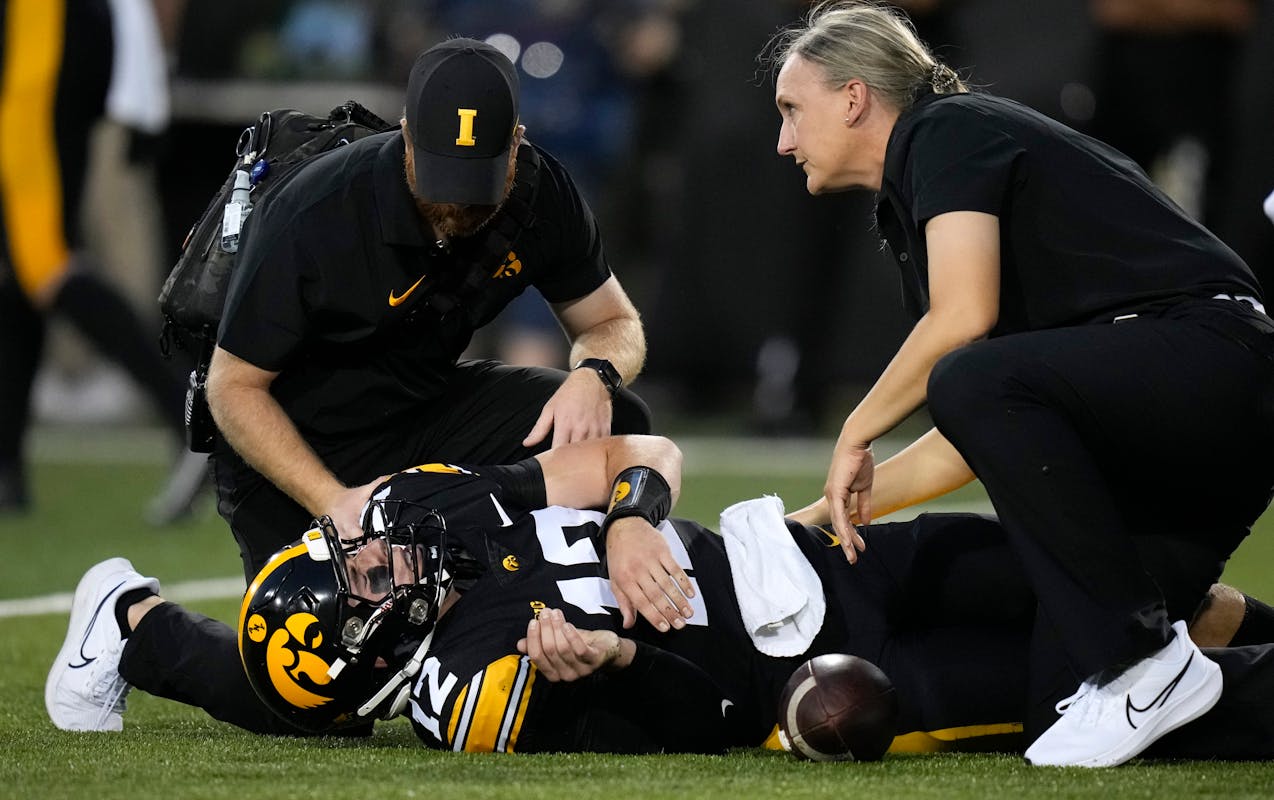 Iowa quarterback Cade McNamara suffered a knee injury in the first half of Saturday night’s victory against Michigan State and did not return to the