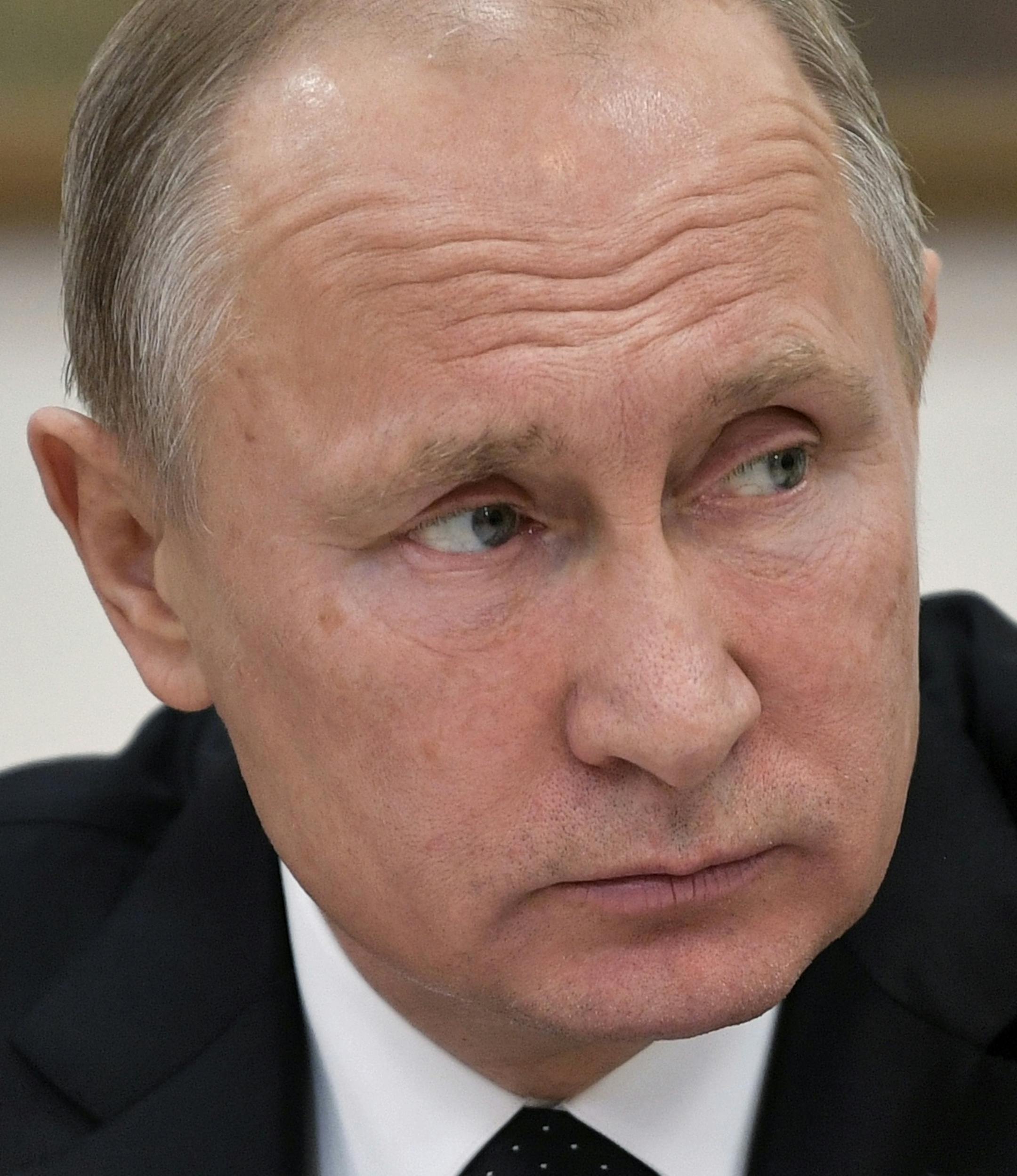 Russian President Vladimir Putin speaks to representatives of public organizations and professional communities assisting people with disabilities at the Russian State Specialized Art Academy in Moscow, Russia, Tuesday, Dec. 5, 2017. (Alexei Nikolsky, Sputnik, Kremlin Pool Photo via AP)