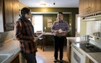 Real estate agent Dan Winters, right, chatted in the kitchen with his client, Dustin Corder, while viewing a home in Columbia Heights earlier this mon