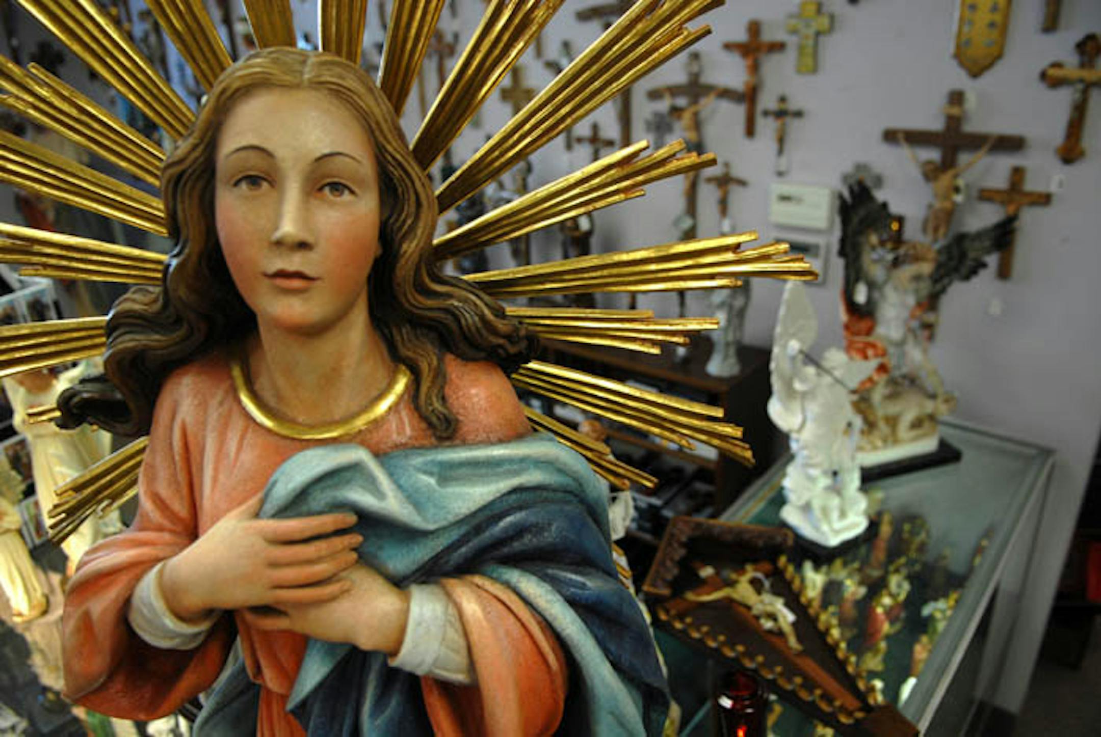 Leaflet Missal Co. in St. Paul has been selling religious products for 80 years, offering more than 10,000 books and gifts such as this statuary. Other items include rosaries, "Jesus rocks" T-shirts, crucifixes and "Table of Saints Organic Colombian Coffee.