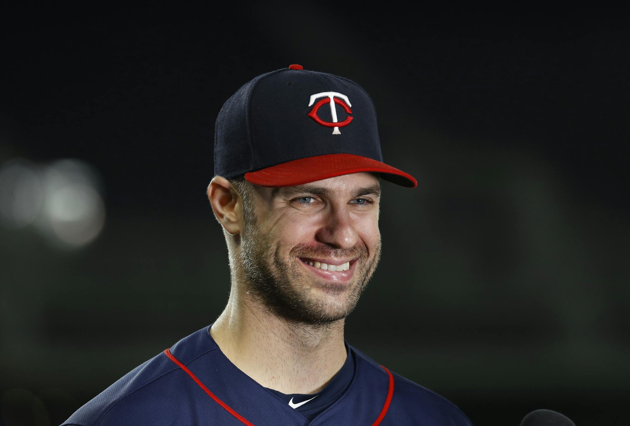 Minnesota Twins' Joe Mauer smiles during an interview after a baseball game against the Detroit Tigers in Detroit, Tuesday, Sept. 18, 2018. (AP Photo/Paul Sancya)