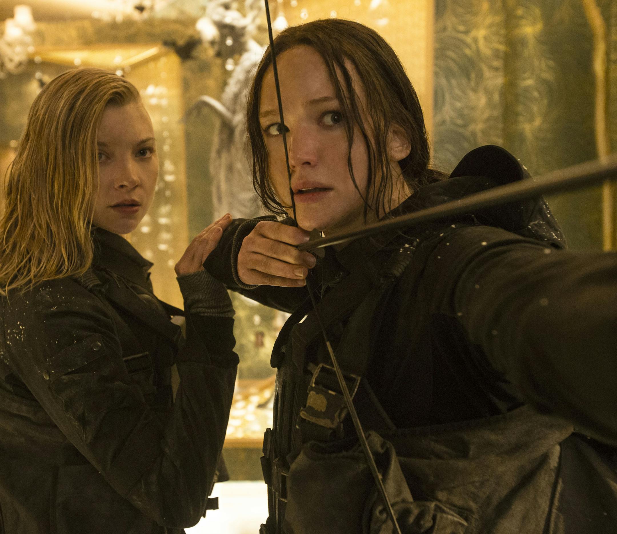 Cressida (Natalie Dormer, left) and Katniss Everdeen (Jennifer Lawrence, right) in THE HUNGER GAMES: MOCKINGJAY - PART 2. Photo Credit: Murray Close
