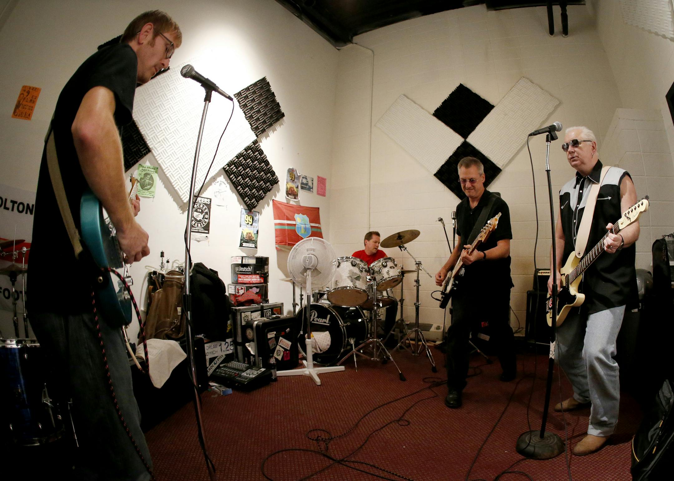 (L to R) Erik Kaiser-Crist (guitar & vocals), Chris Schoonover (drums), Doug Heeschen (bass), and Stephen Brookfield (guitar & vocals) of The 99ers played during a rehearsal. Brookfield is a world-renown educator who is the author of multiple award-winning books, sits on educational boards in four countries and holds the John Ireland Endowed Chair in the University of St. Thomas education department. ] CARLOS GONZALEZ cgonzalez@startribune.com - November 18, 2013, Minneapolis, Minn., Stephen Bro