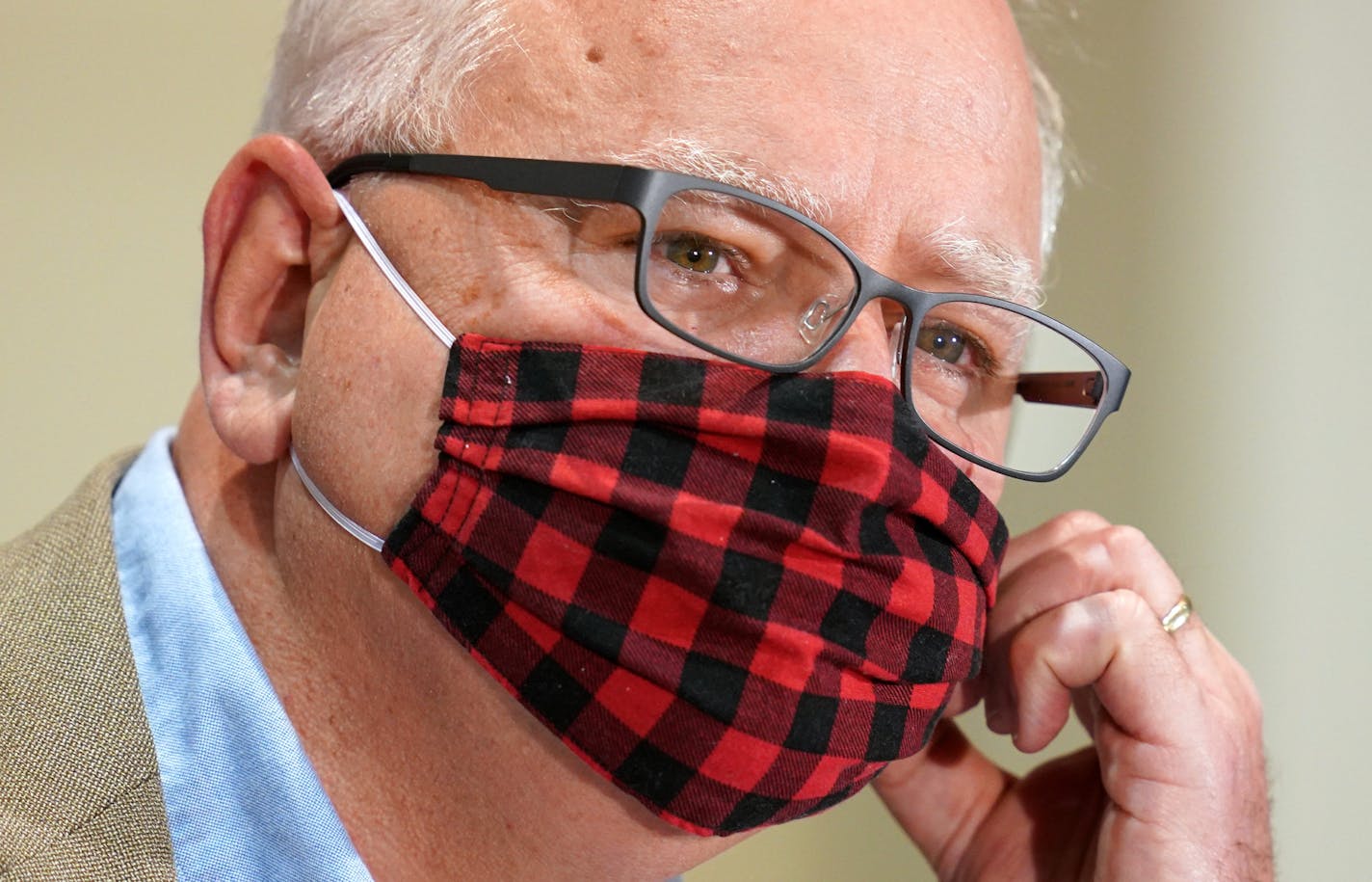 Gov. Tim Walz wore his buffalo plaid cloth mask during questions at a press conference to announce a statewide mask mandate to help slow the spread of COVID-19 Wednesday. ] ANTHONY SOUFFLE • anthony.souffle@startribune.com Gov. Tim Walz and Lt. Gov. Peggy Flanagan held a press conference to announce a statewide mask mandate to help slow the spread of COVID-19 Wednesday, July 22, 2020 at the Department of Revenue building in St. Paul, Minn. Also in attendance was Department of Health Commissioner