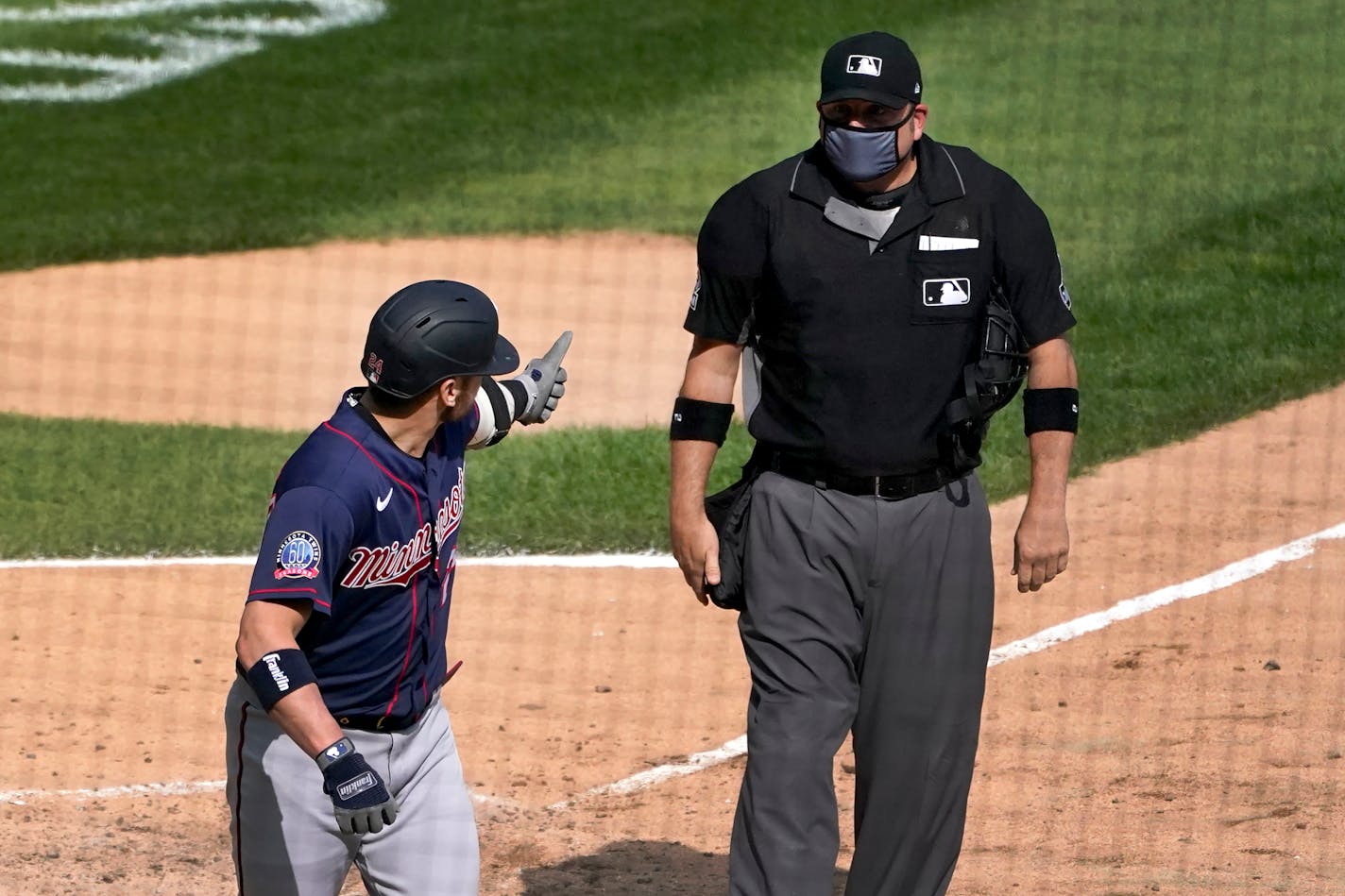 The Twins' Josh Donaldson gives home plate umpire Dan Bellino the thumbs up sign after Bellino ejected him from the game on Thursday.