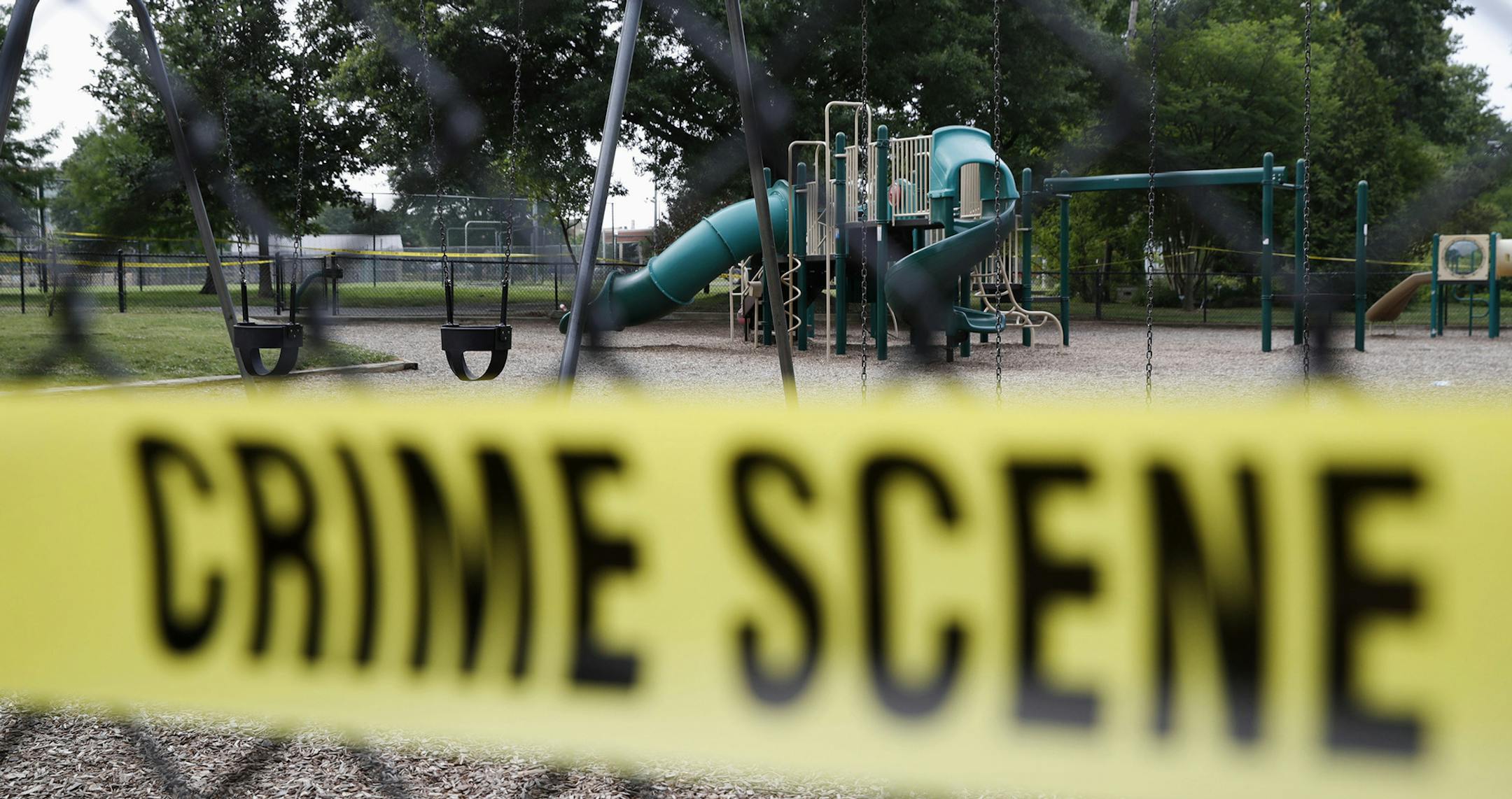 A playground near the baseball field is cordoned off with police tape as the investigation continue at the scene in Alexandria, Va., Thursday, June 15, 2017, the day after House Majority Whip Steve Scalise of La. was shot during during a congressional baseball practice. (AP Photo/Jacquelyn Martin) ORG XMIT: MIN2017061513504849