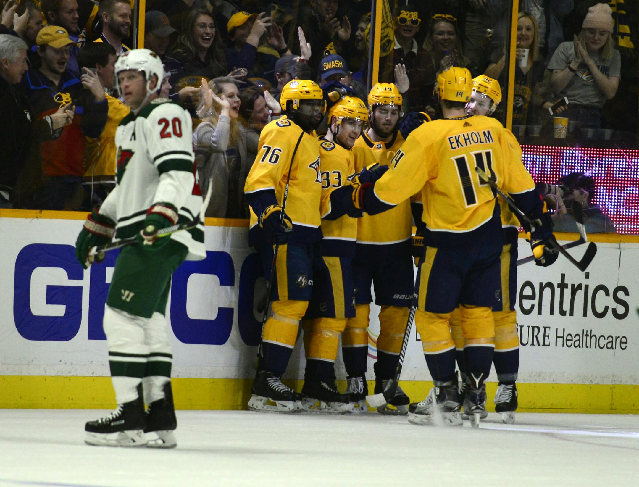 Nashville Predators forward Viktor Arvidsson (33) is congratulated after scoring against the Minnesota Wild in the third period of an NHL hockey game Saturday, Dec. 30, 2017, in Nashville, Tenn. (AP Photo/Mike Strasinger)