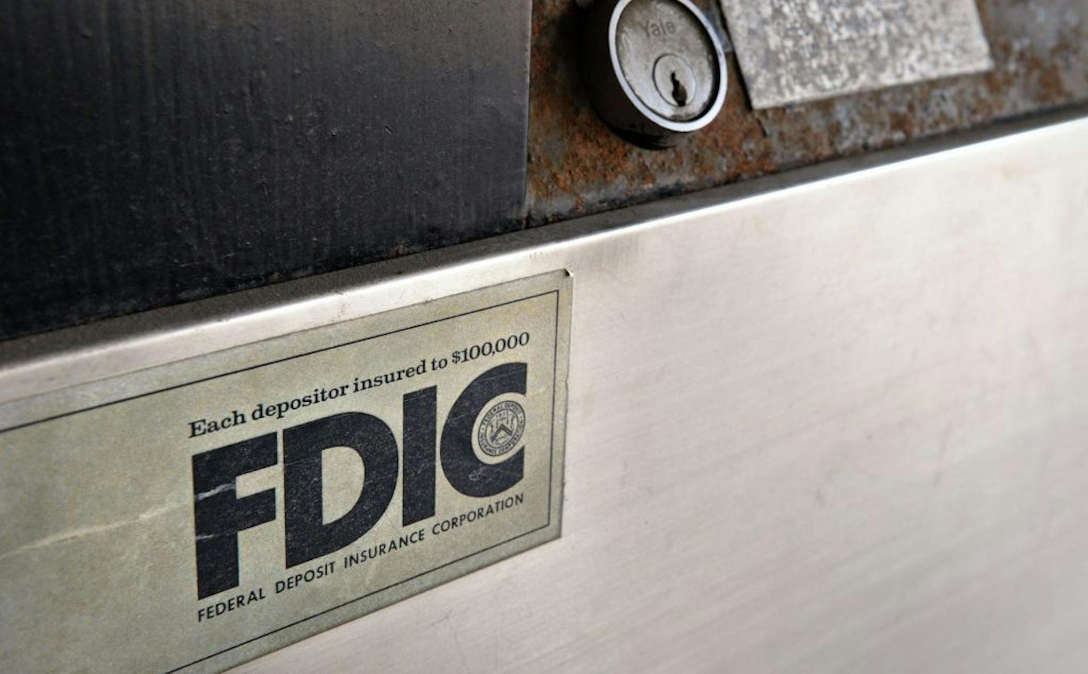 FDIC sign on a bank night deposit box,