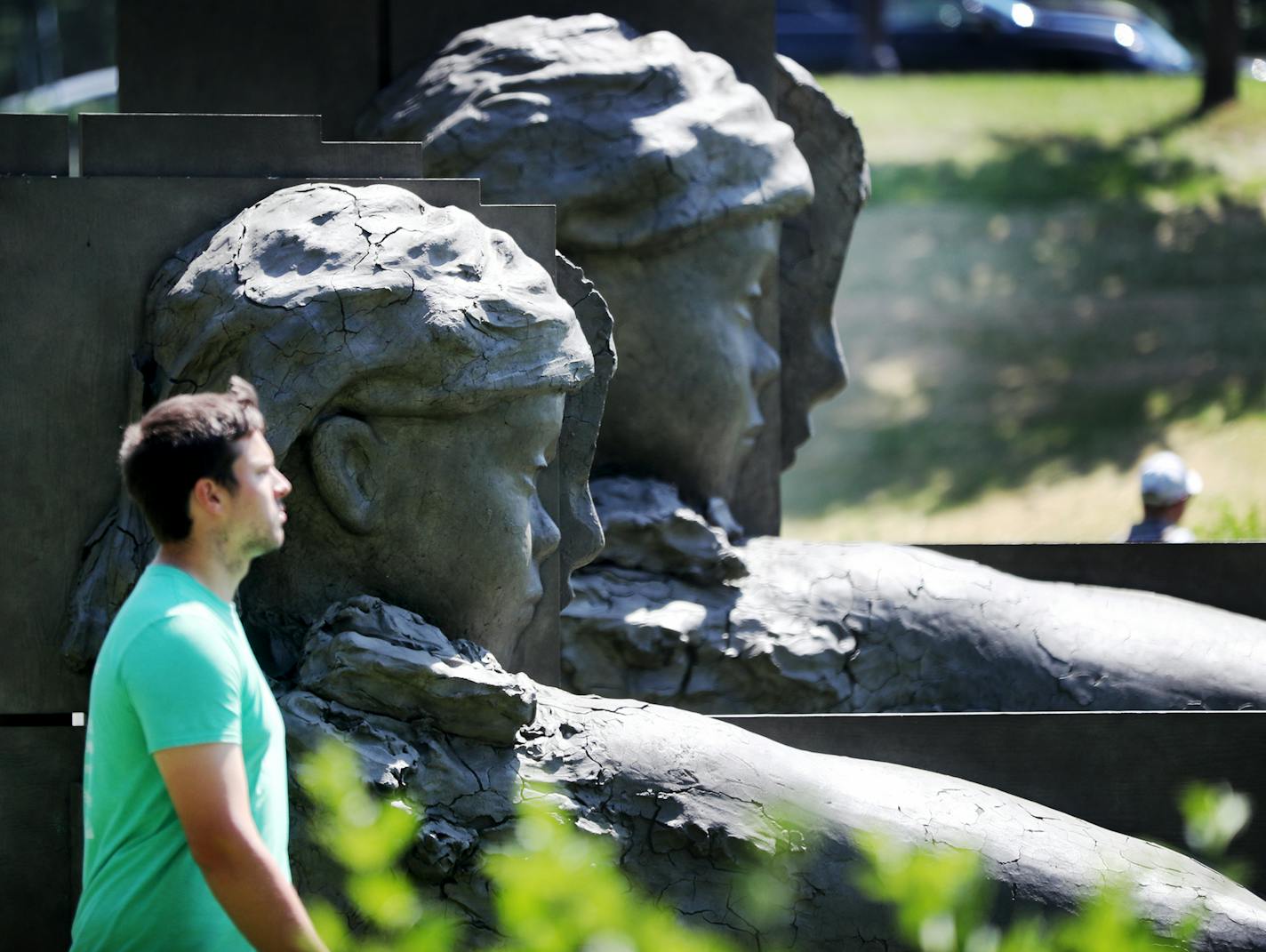 The re-opening day at the Minneapolis Sculpture Garden Saturday, June 10, 2017, in Minneapolis, MN. Here, a visitor walks by Mark Manders September Room (Room with Two Reclining Figures and Composition with Long Verticals) 2017, officially re-opening the Minneapolis Sculpture Garden.] DAVID JOLES &#xef; david.joles@startribune.com re-opening day at the Minneapolis Sculpture Garden