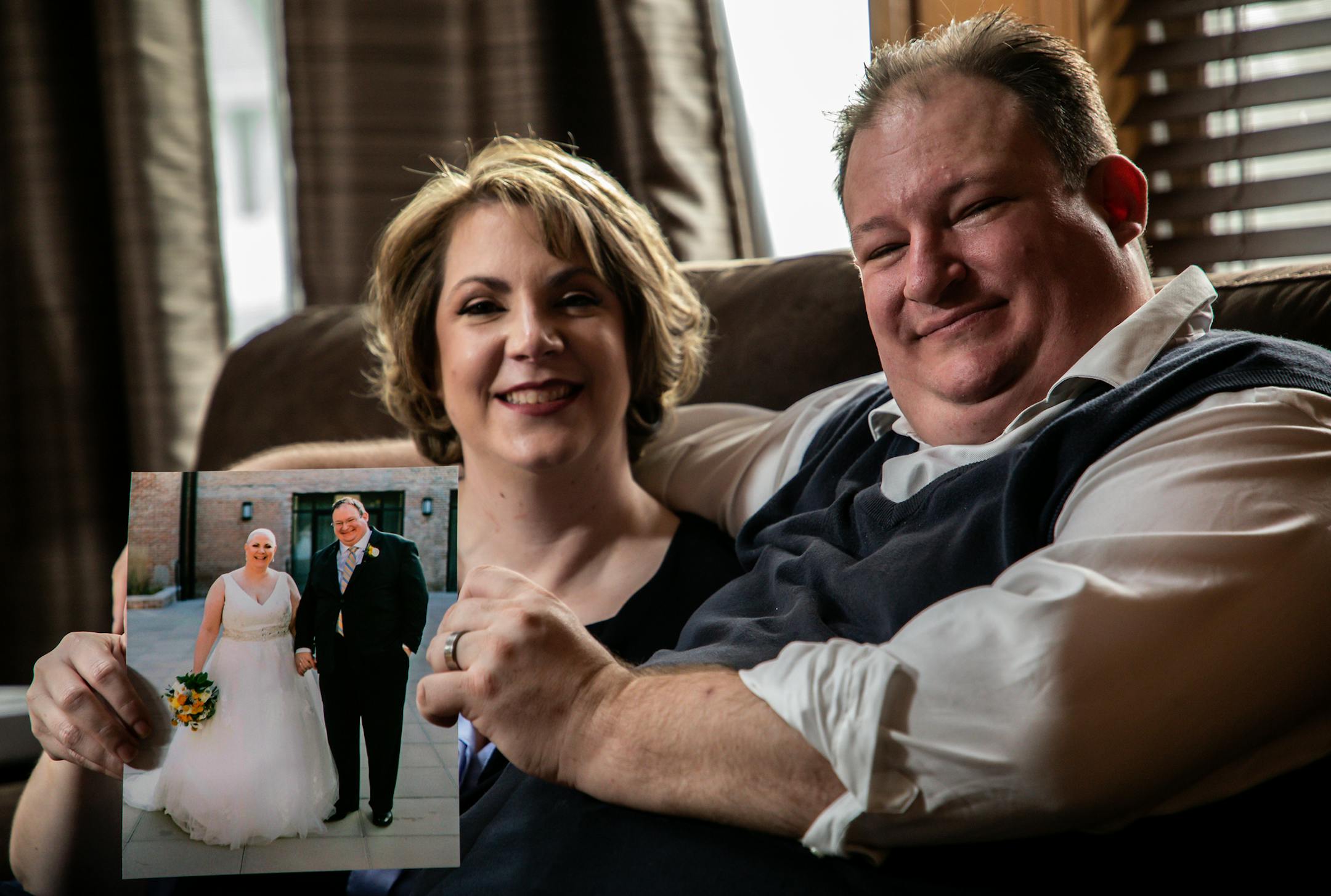 Angela, 43, and Brad Andrews, 42, at their home in Crown Point on Monday, Nov. 4. 2019. They were married on Dec. 11, 2018, with help of the Wish Upon A Wedding, a Midwest-based nonprofit, granting weddings and vow renewals to couples facing serious illness or a life-altering circumstance. (Zbigniew Bzdak/Chicago Tribune/TNS) ORG XMIT: 1482415 ORG XMIT: MIN1911081051431055