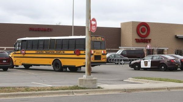 A school bus whose driver got lost with kids aboard is parked in a Target parking lot Tuesday, Oct. 28, in Crystal.