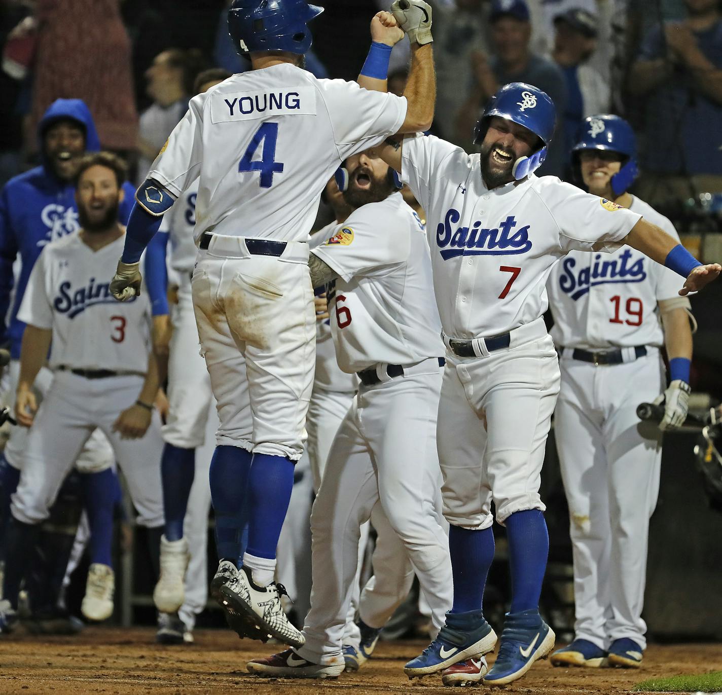 Players, including Josh Allen, right, celebrate Saints player Chesny Young's grand slam in the sixth inning. ] LEILA NAVIDI &#x2022; leila.navidi@startribune.com BACKGROUND INFORMATION: The Saint Paul Saints play the Sioux City Explorers in Game 3 of the American Association Championship Series at CHS Field in St. Paul on Saturday, September 14, 2019. The Saint won the game 6-3 to become the 2019 American Association Champions.