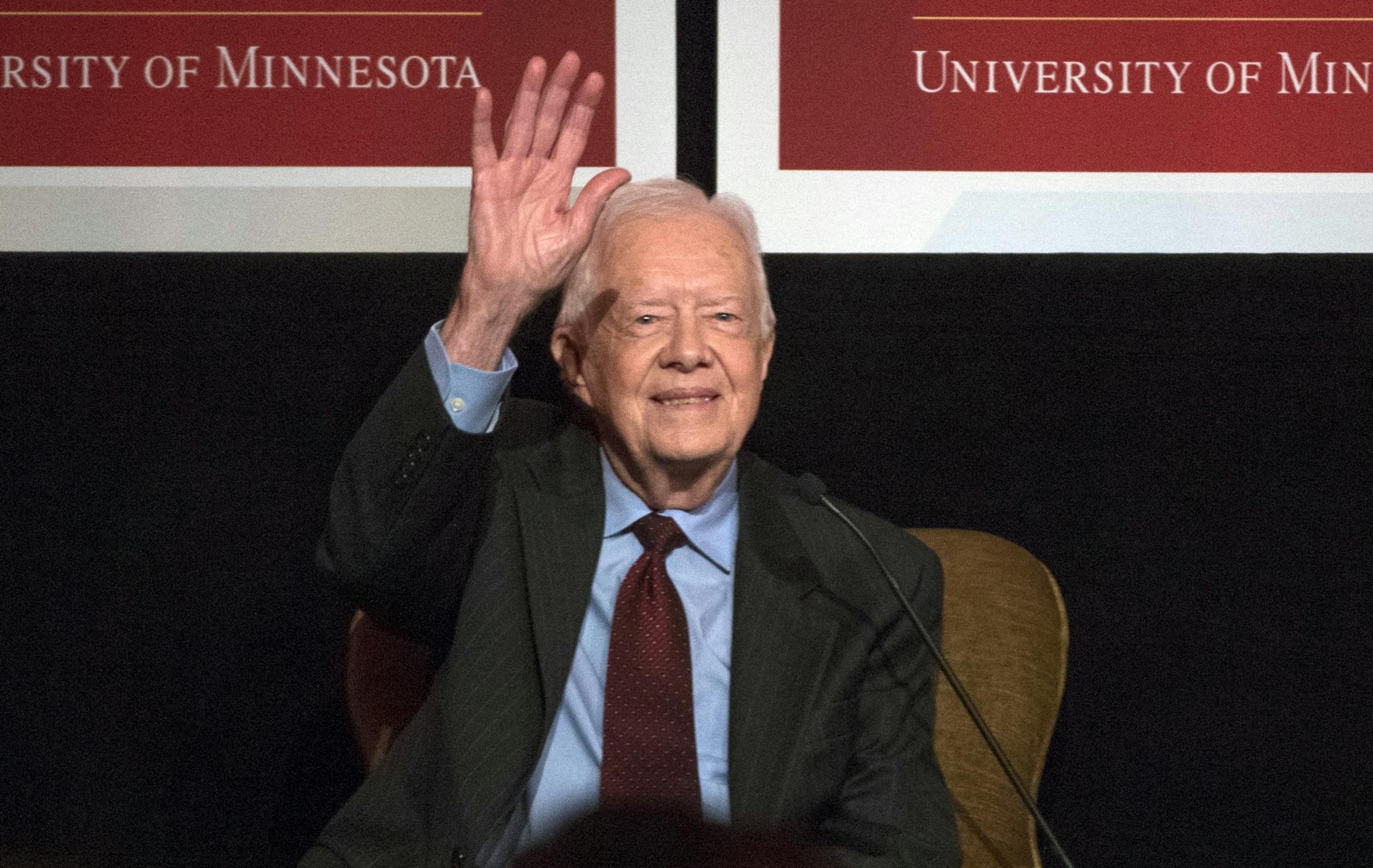 Former President Jimmy Carter waves after participating in a tribute to former Vice President Walter Mondale in Washington, Tuesday, Oct. 20, 2015.