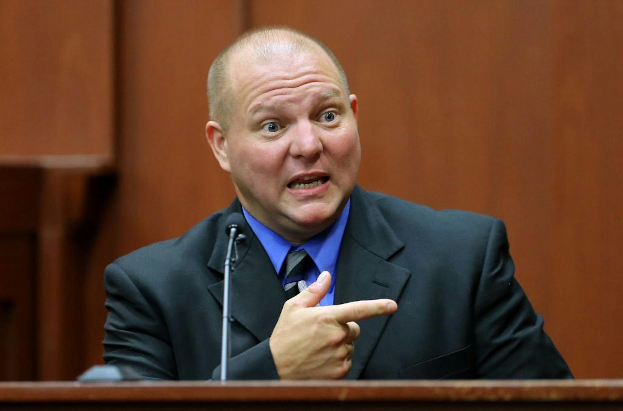 Mark Osterman, a friend of George Zimmerman, describes the type of gun Zimmerman owned while testifying during Zimmerman trial in Seminole Circuit Court, in Sanford, Fla., Monday, July 8, 2013.