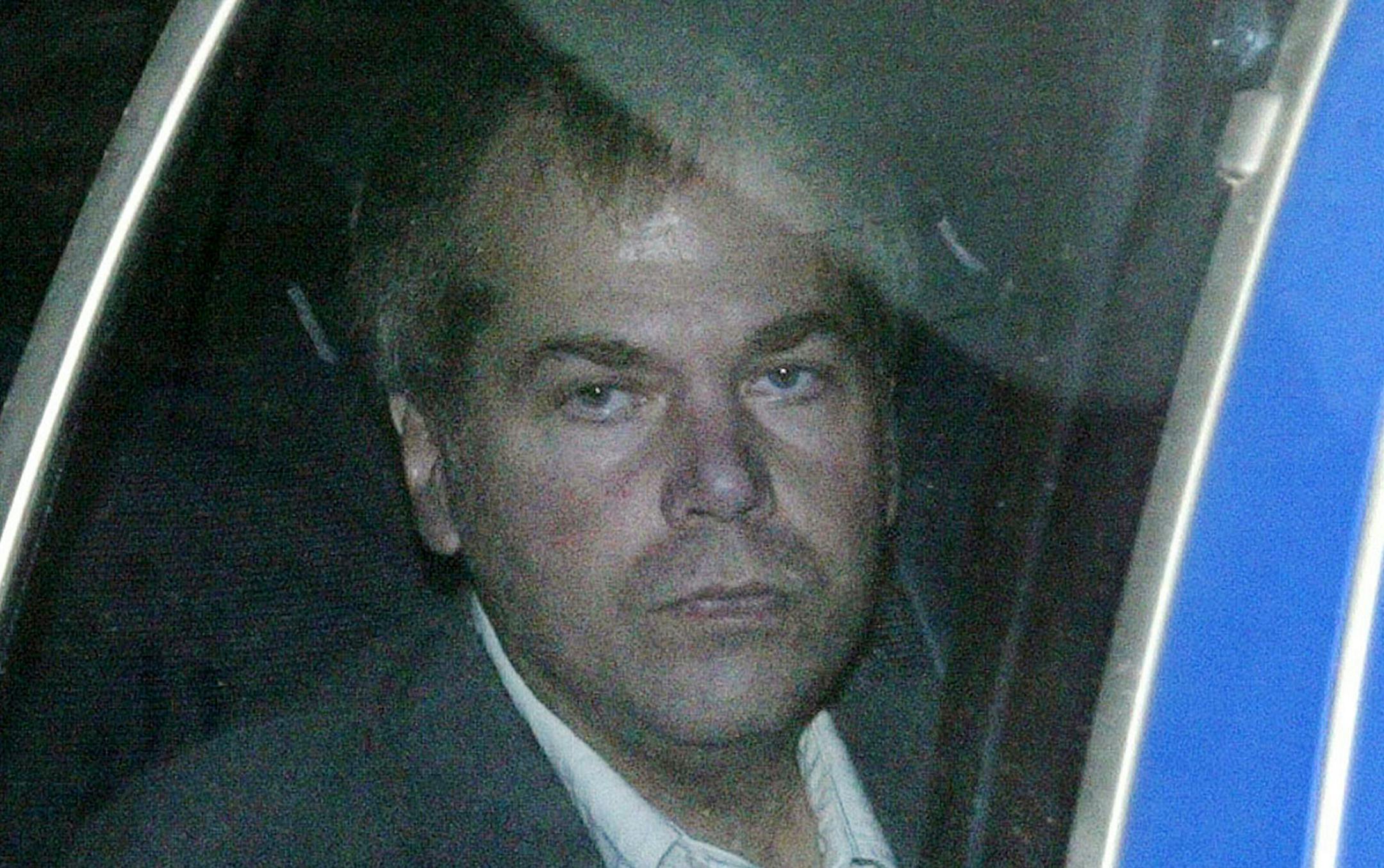 FILE - In this Nov. 18, 2003 file photo, John Hinckley Jr. arrives at U.S. District Court in Washington. The last man to shoot an American president now spends most of the year in a house overlooking the 13th hole of a golf course in a gated community. He takes long walks along tree-lined paths, plays guitar and paints, grabs fast food at Wendy’s. He drives around town in a silver Toyota Avalon, a car that wouldn’t attract a second glance. Often, as if to avoid detection, he puts o