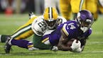 Vikings wide receiver Stefon Diggs (14) was tackled by Green Bay Packers cornerback Damarious Randall (23) after a second quarter pass reception. ] JE