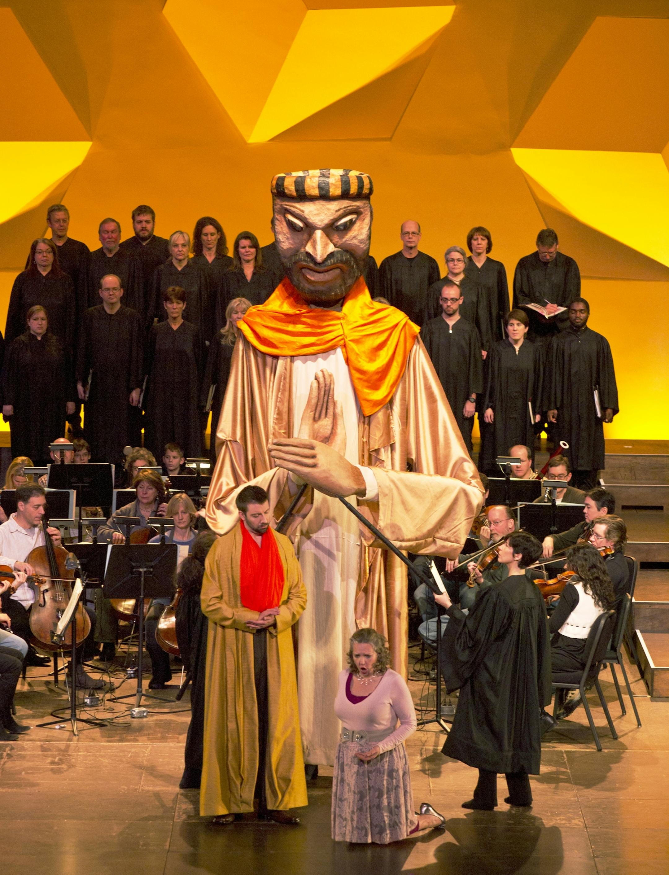 Singers share the stage with big puppets in Minnesota Orchestra's "Magic Flute."