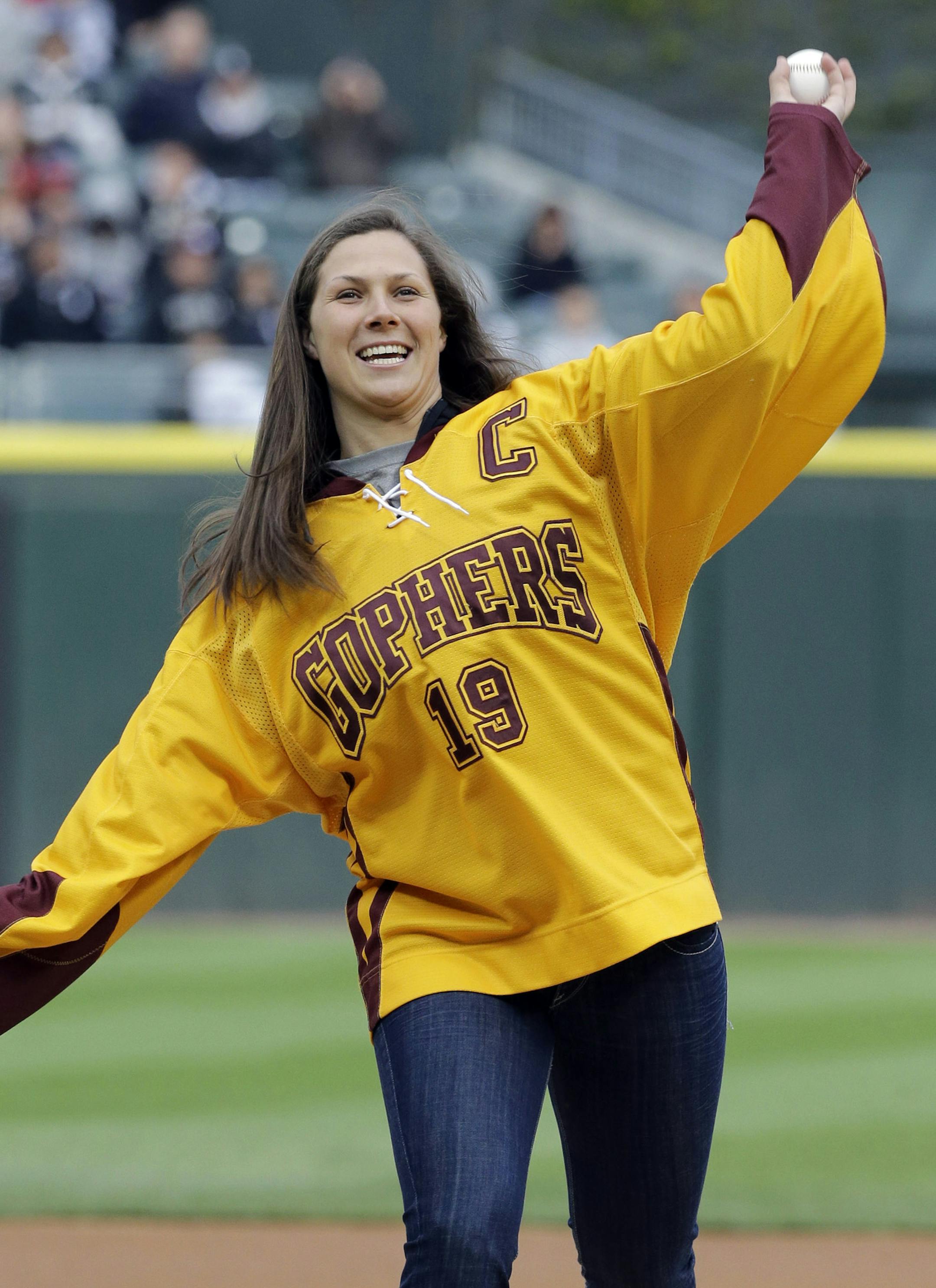 Minnesota women's hockey team's Megan Bozek throws out a ceremonial first pitch before a baseball game between the Los Angeles Angels and the Chicago White Sox in Chicago, Saturday, May 11, 2013. (AP Photo/Nam Y. Huh)