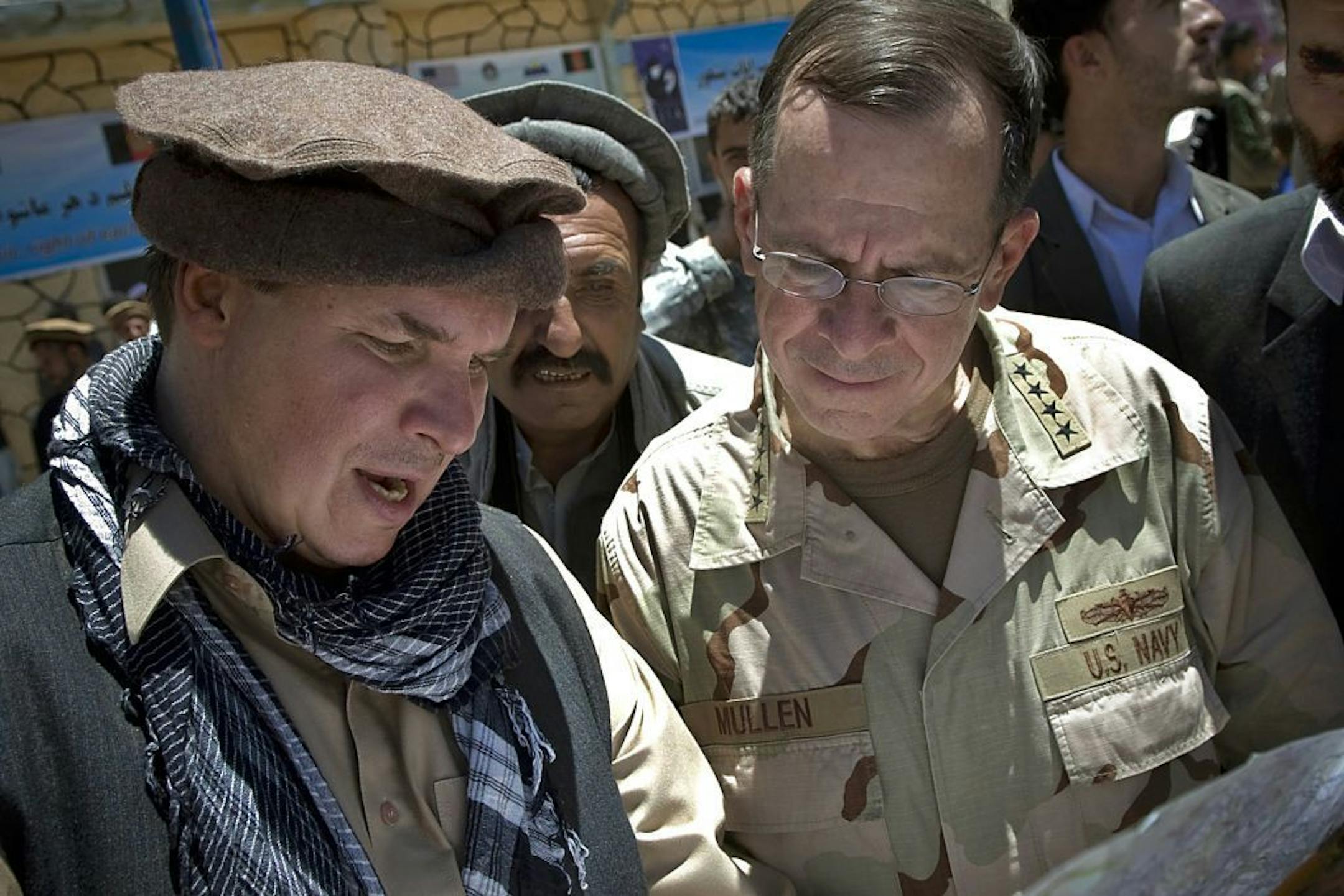 In this 2009 file photo, "Three Cups of Tea" author and St. Cloud native Greg Mortenson, left, showed the locations of future village schools to U.S. Navy Adm. Mike Mullen.