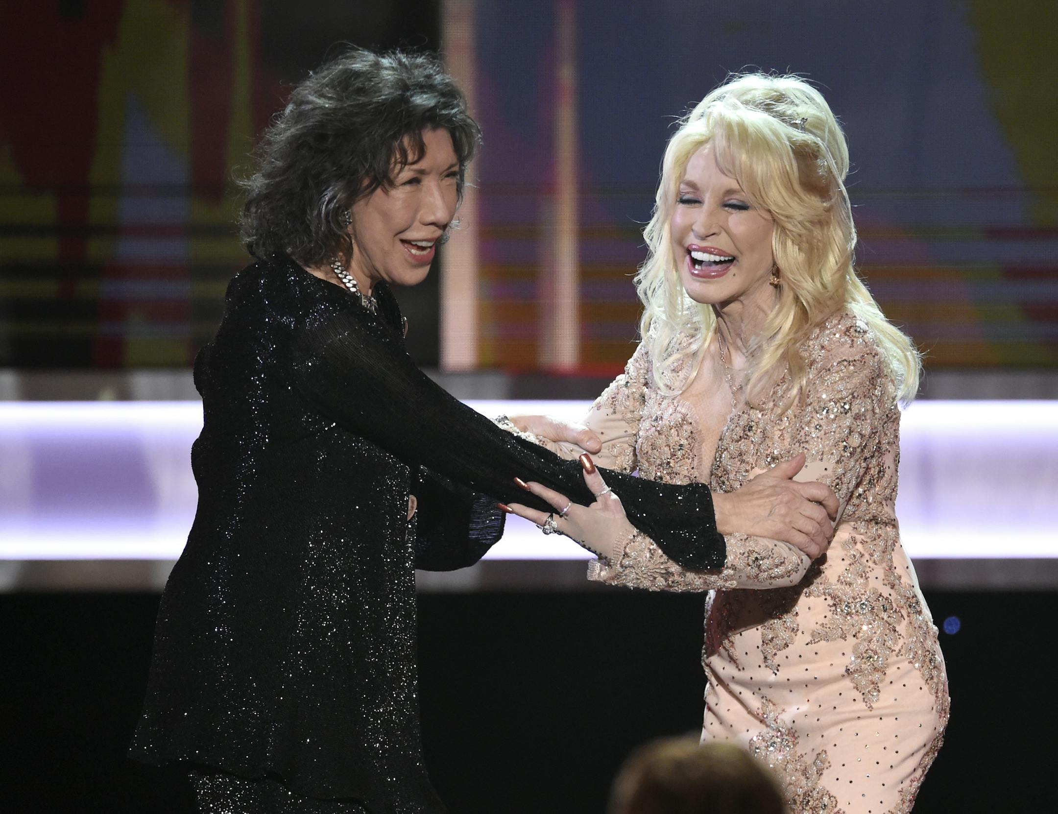 Dolly Parton, right, presents Lily Tomlin with the Lifetime Achievement Award at the 23rd annual Screen Actors Guild Awards at the Shrine Auditorium & Expo Hall on Sunday, Jan. 29, 2017, in Los Angeles. (Photo by Chris Pizzello/Invision/AP)