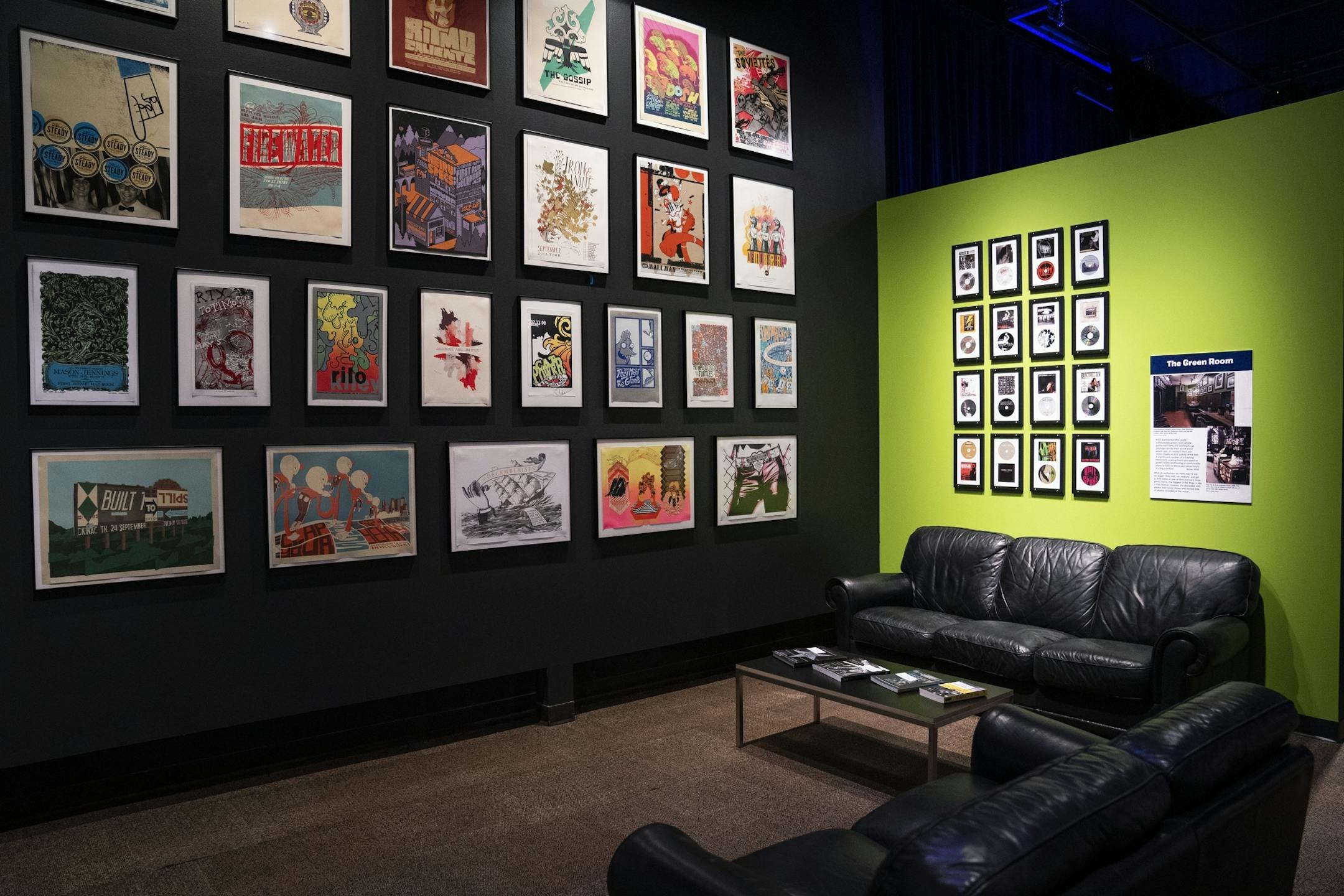 The green room area, which features band posters and photos of the green room at First Avenue.
