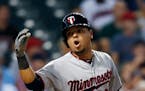 Minnesota Twins' Juan Centeno reacts after being struck out by Cleveland Indians relief pitcher Cody Allen during the ninth inning of a baseball game,