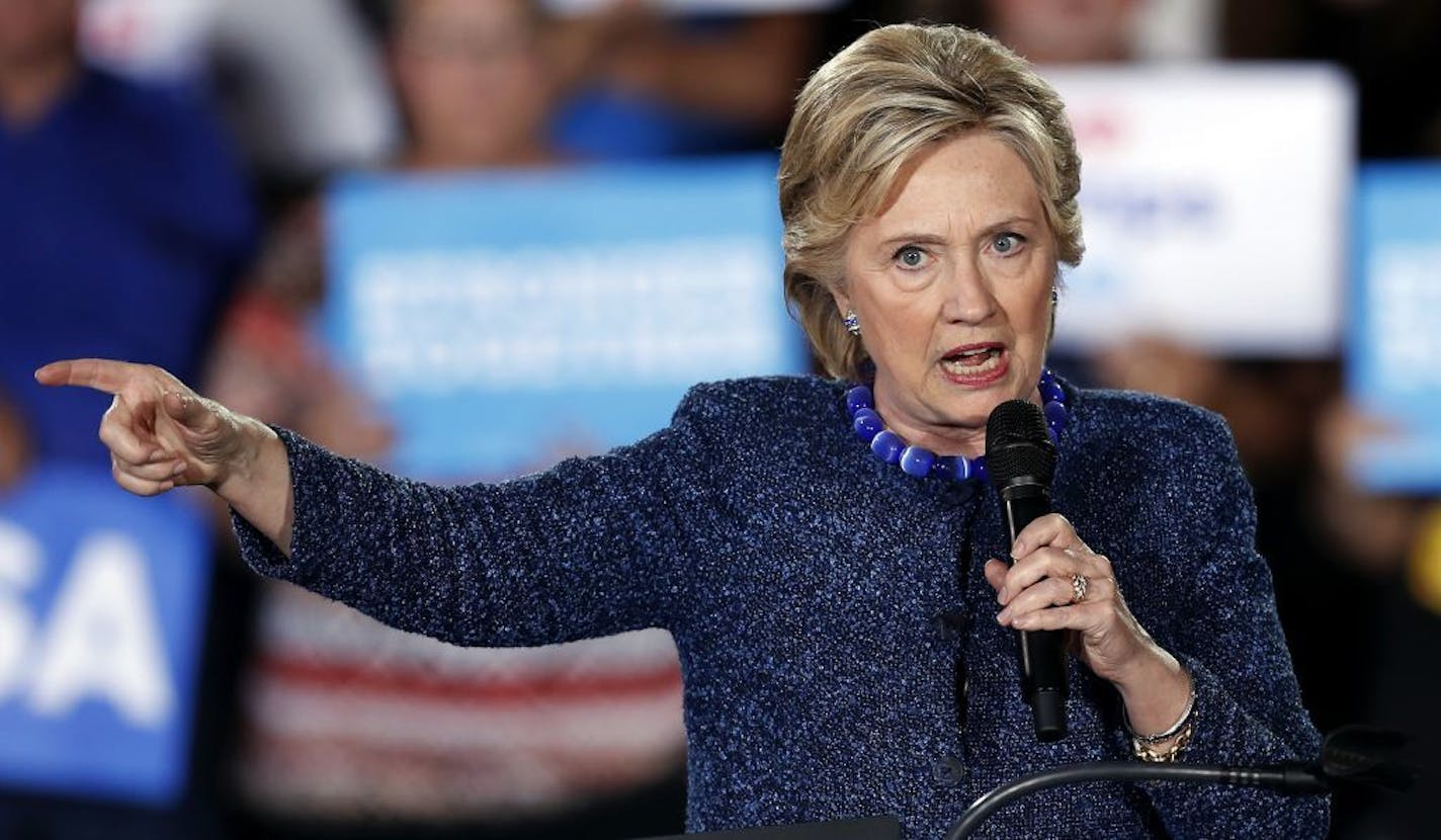 Democratic presidential candidate Hillary Clinton, shown speaking Friday at a high school in Des Moines, urged the FBI to "explain this issue in question, whatever it is, without any delay."