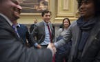 Shortly after being sworn-in as the Mayor of Minneapolis, Jacob Frey was greeted and greeted other newly sworn-in council members in the City Council 