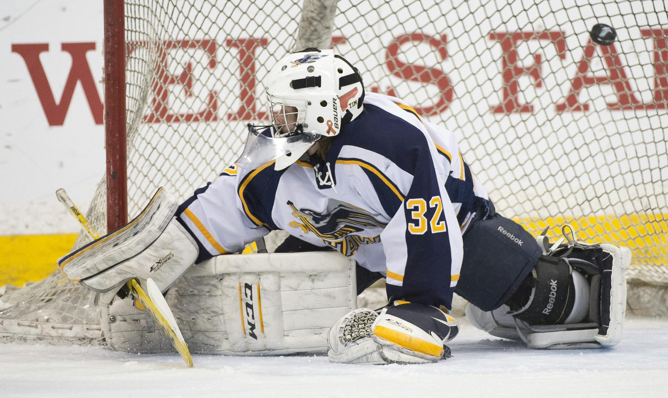 A shot hit by East Grand Forks center Austin Monda (8) makes it past Hermantown goalie Luke Olson (32) for a goal in the first period. ] (Aaron Lavinsky | StarTribune) Germantown plays East Grand Forks in the Class 1A boys' hockey state championship game on Saturday, March 7, 2015 at Xcel Energy Center.