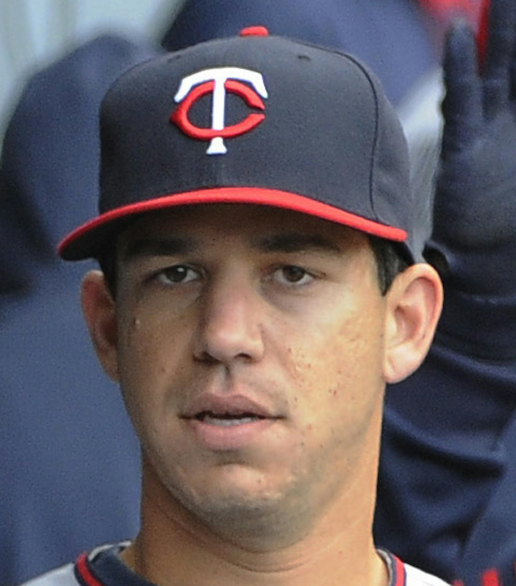 Minnesota Twins starting pitcher Tommy Milone (33) is greeted by his teammates after leaving the baseball game against the Chicago White Sox during the eighth inning Friday, April 10, 2015,in Chicago. The Twins won 6-0. (AP Photo/David Banks) ORG XMIT: CXS125