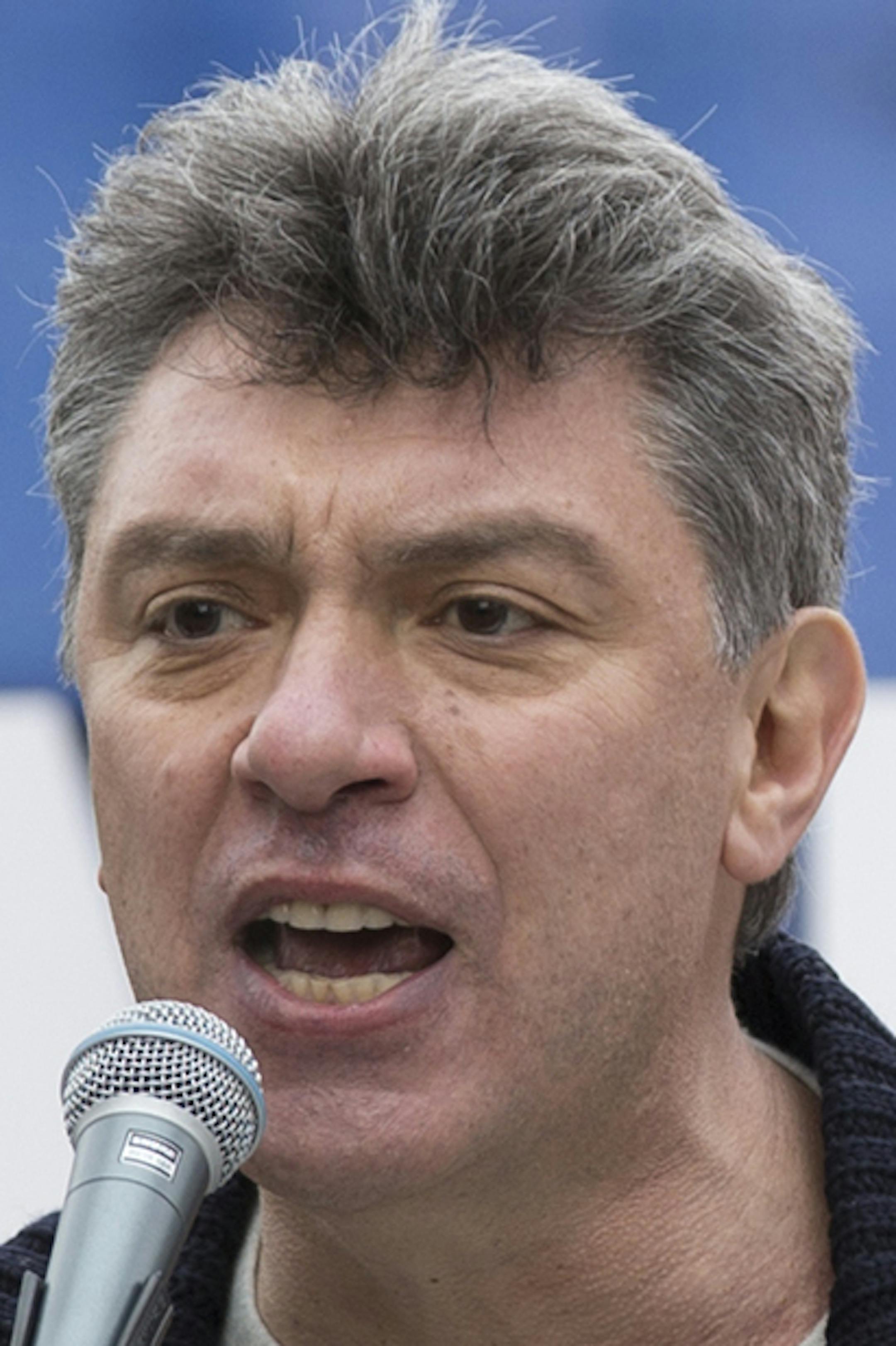 In this photo taken on Saturday, March 15, 2014, Boris Nemtsov, a former Russian deputy prime minister and opposition leader addresses demonstrators during a massive rally to oppose president Vladimir Putin's policies in Ukraine, in Moscow, Russia. Nemtsov was gunned down Saturday near the Kremlin, just a day before a planned protest against the government. (AP Photo/Alexander Zemlianichenko) ORG XMIT: MIN2015031112061932