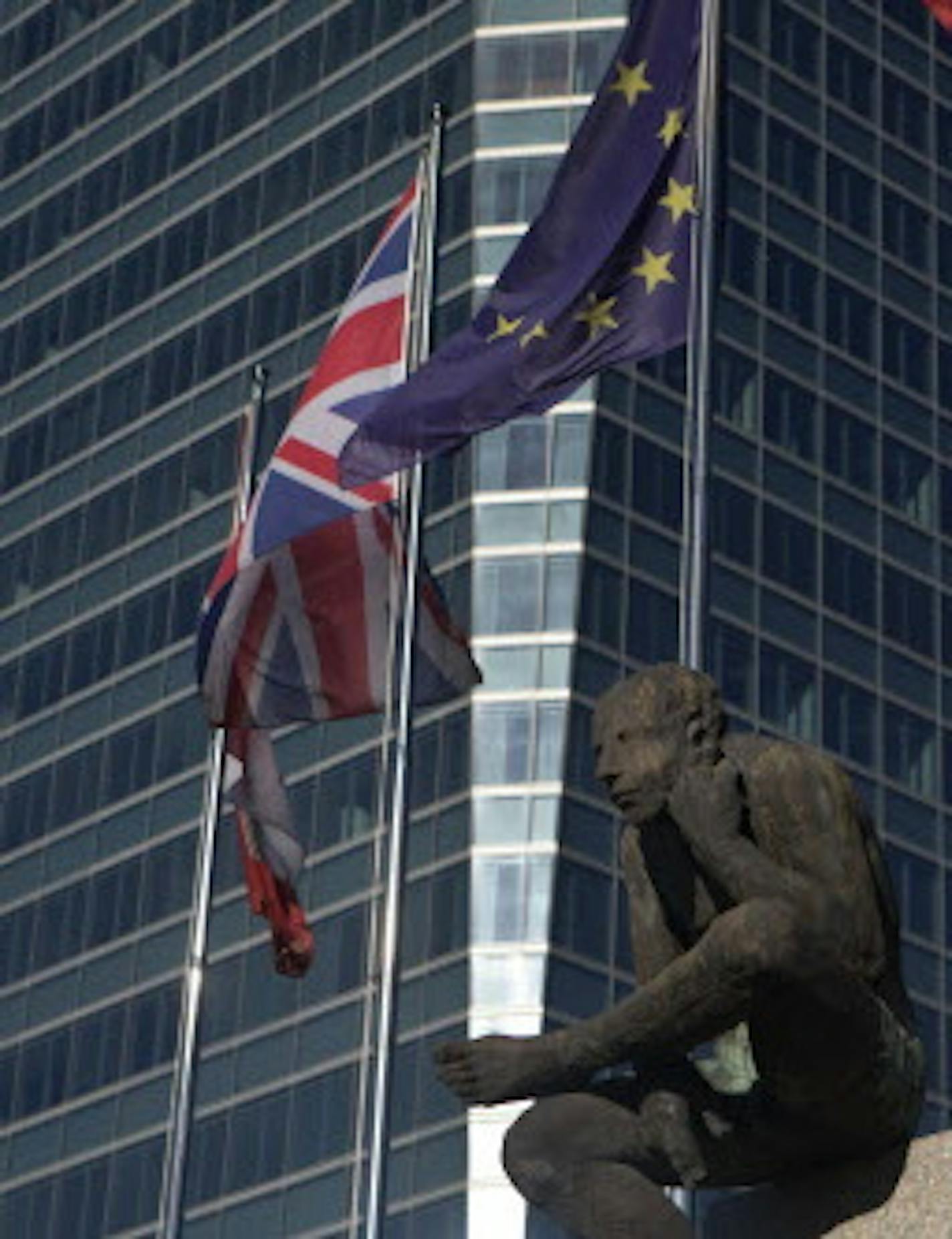 The British and EU flags fly together in the business district of Madrid, Spain, Tuesday, June 21, 2016. British voters head to the polls on Thursday to decide if the country should stay in the European Union or leave it. (AP Photo/Paul White)