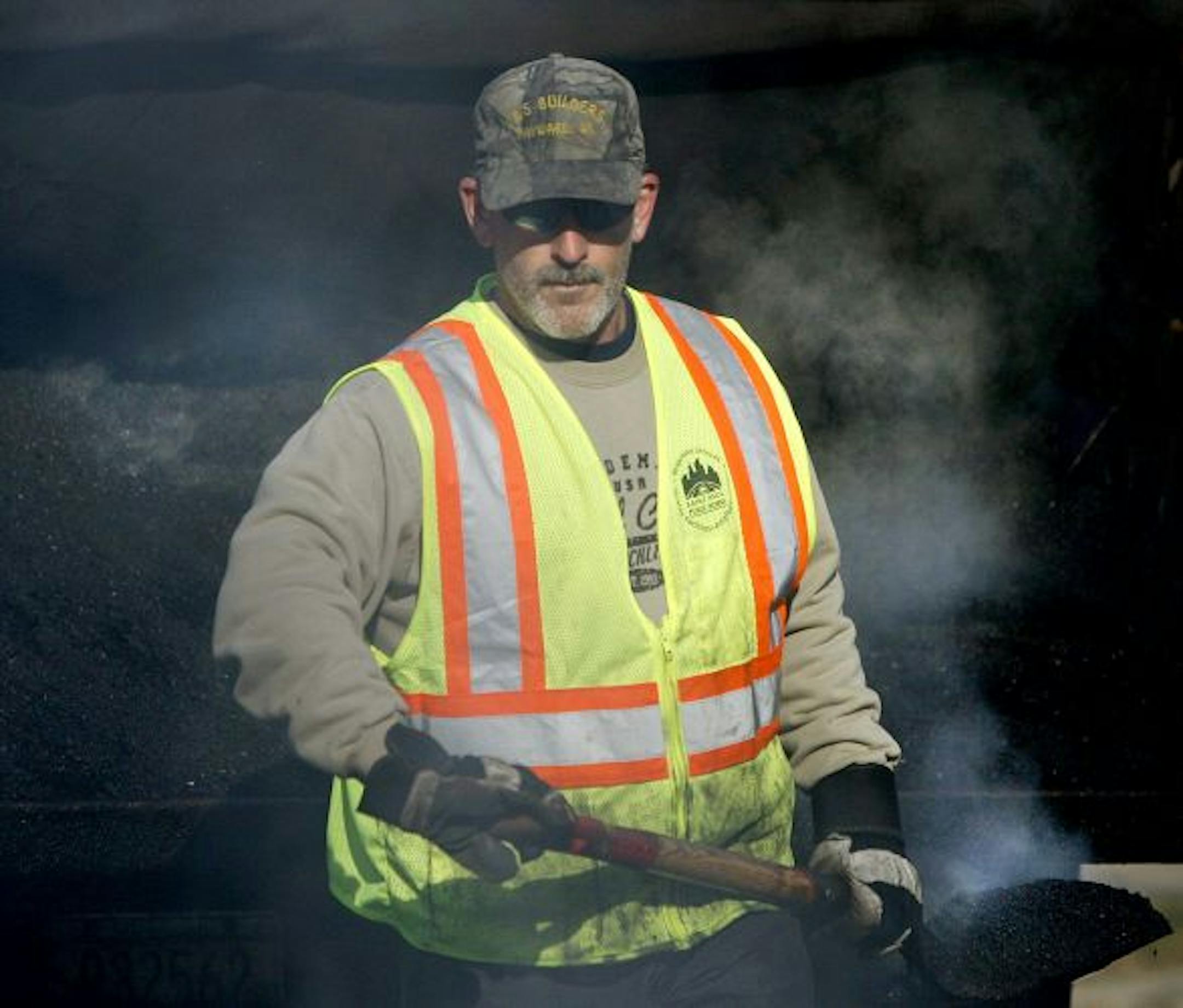 St. Paul Public Works crew worked on filling pot holes along Summit Avenue.