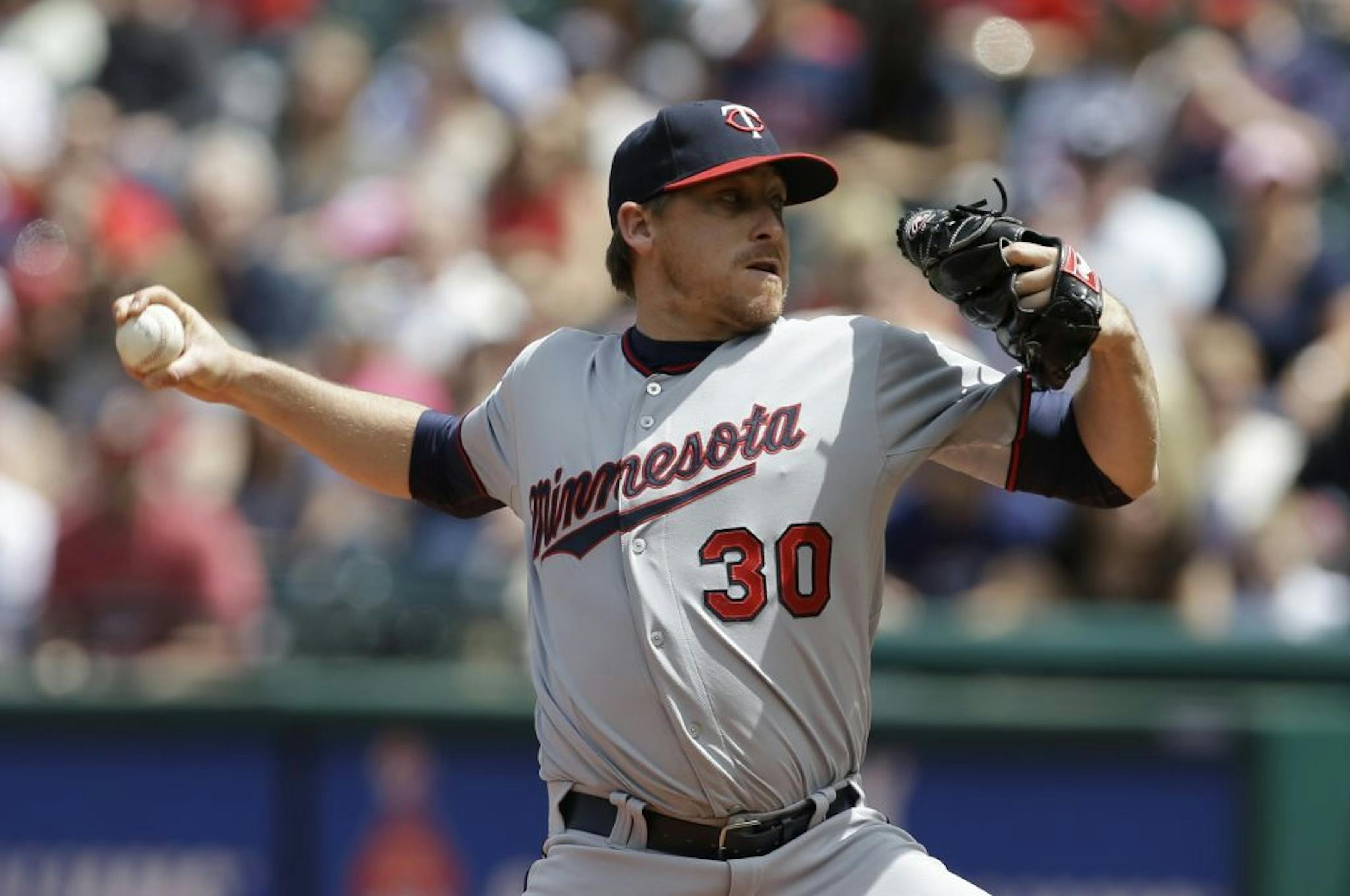 Minnesota Twins starting pitcher Kevin Correia delivers a pitch in the first inning of a baseball game against the Cleveland Indians, Saturday, May 4, 2013, in Cleveland.