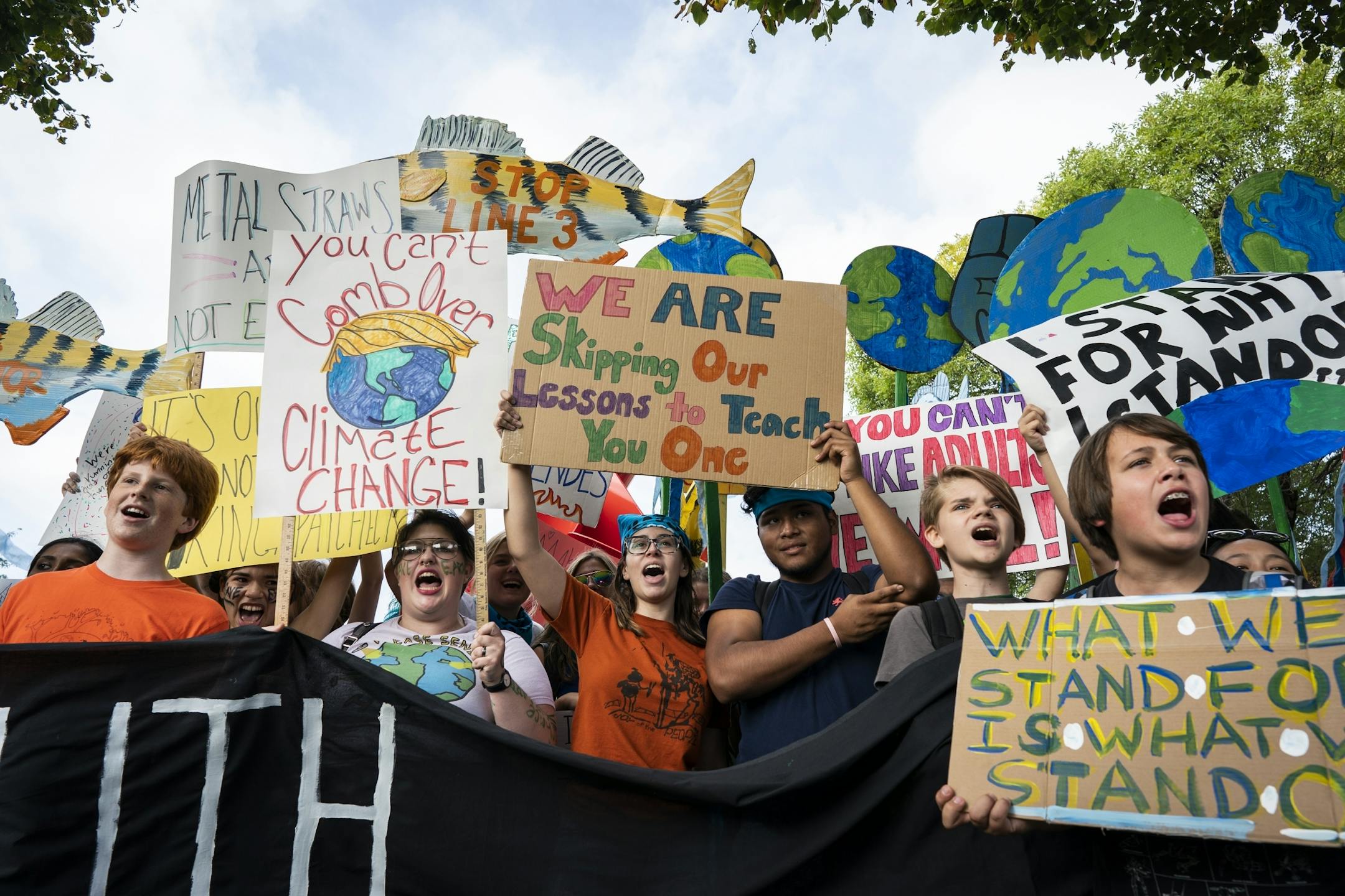 Protesters gathered at Western Sculpture Park to protest climate change inaction.