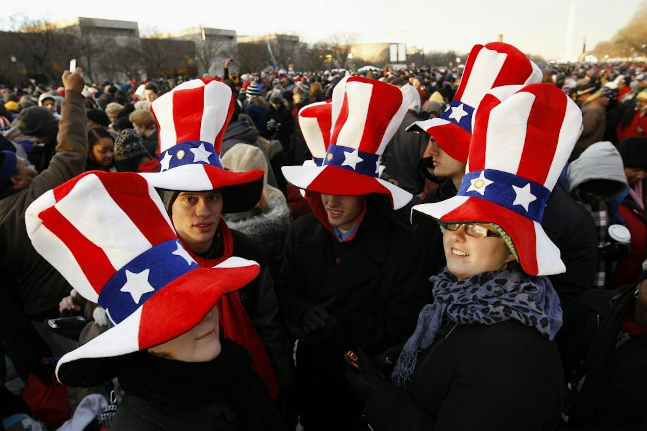President Barack Obama supporters wait on the National Mall in Washington, Monday, Jan. 21, 2013, for the start of President Barack Obama's ceremonial swearing in during the 57th Presidential Inauguration.
