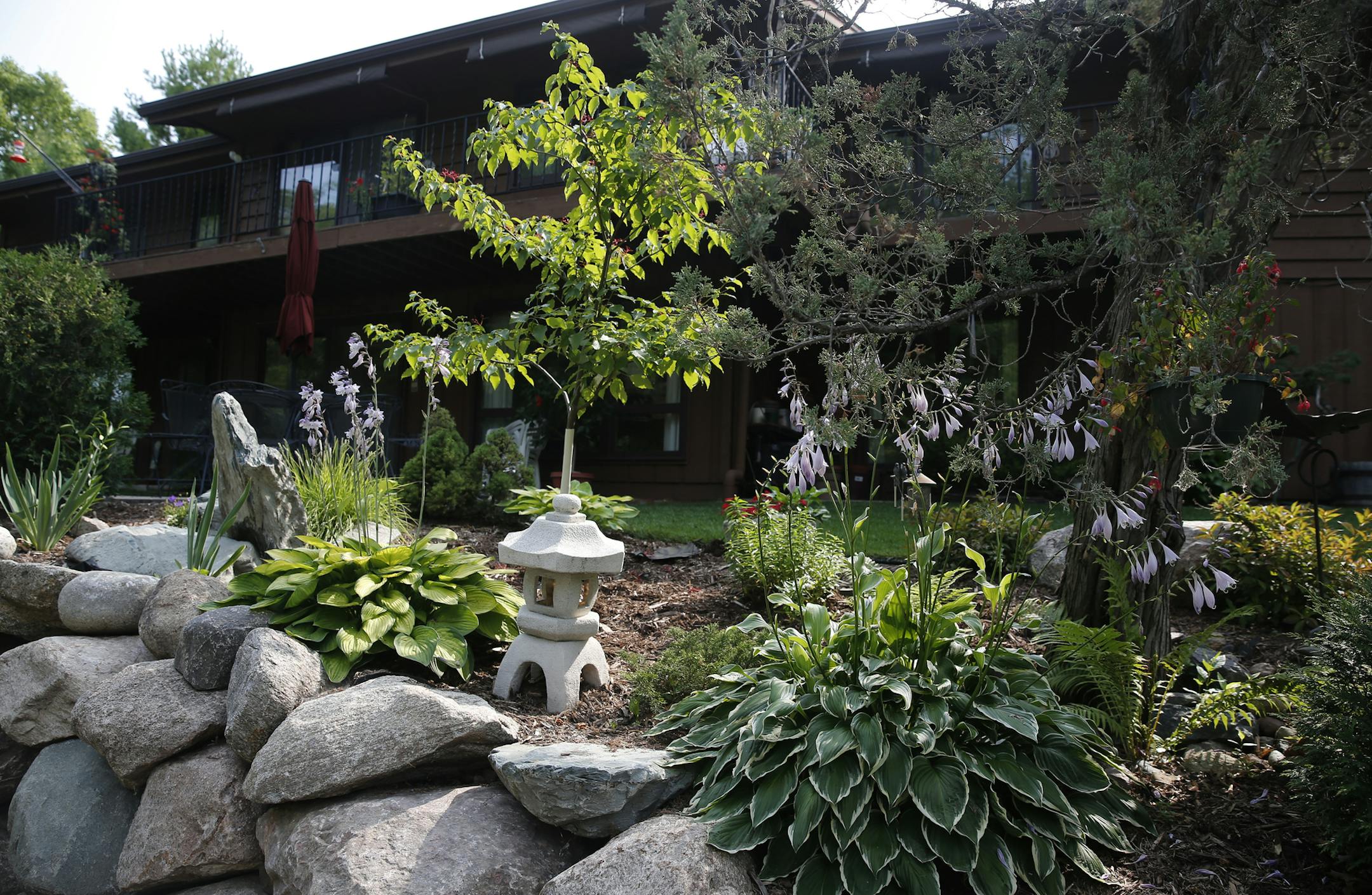 Beautiful Garden contest winners Jim and Sally Strand tend an Asian-inspired garden complete with 23 distinct planting areas in their Plymouth yard. The garden also encompasses many feet of lakeshore. ] Richard Tsong-Taatarii/ rtsong- taatarii@startribune.com