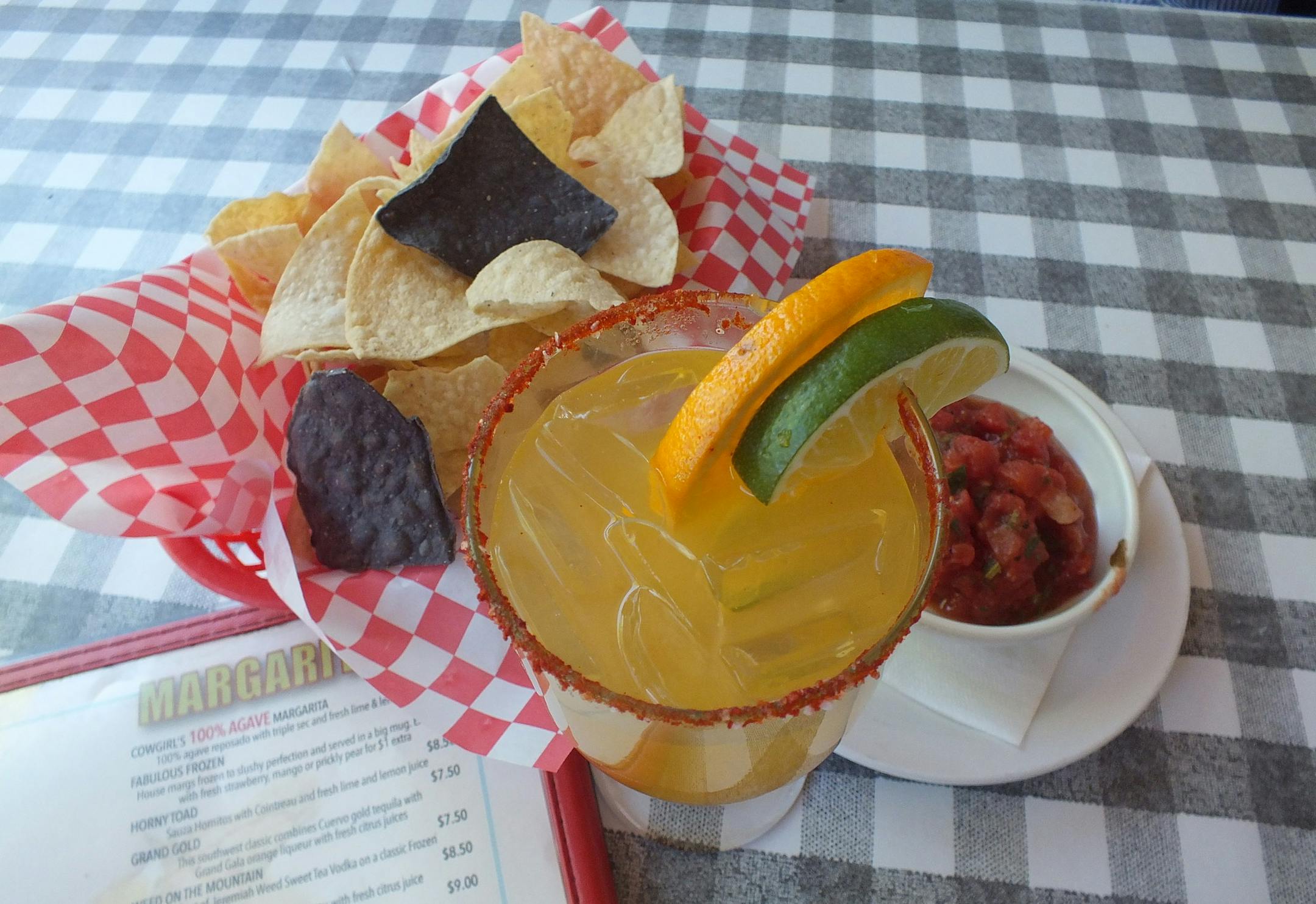Chips and salsa accompany the Cadillac margarita at Cowgirl, a barbecue restaurant near Santa Fe’s Railyard District.