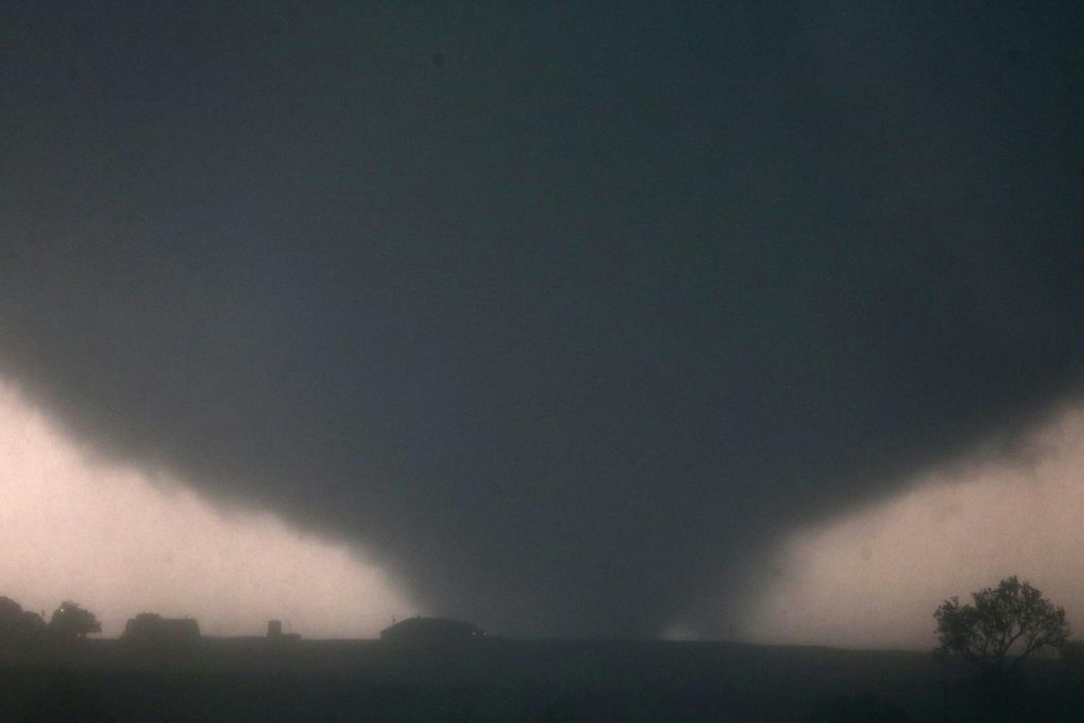 A tornado touches down near El Reno, Okla., Friday, May 31, 2013, causing damage to structures and injuring travelers on Interstate 40. I-40 has been closed after severe weather rolled through the area. (AP Photo/The Omaha World-Herald, Chris Machian) MANDATORY CREDIT