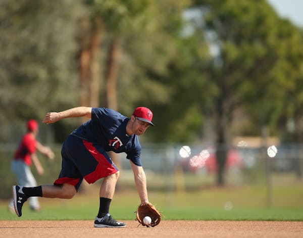 Twins second baseman Brian Dozier fielded a grounder during a workout Tuesday morning at Hammond Stadium.