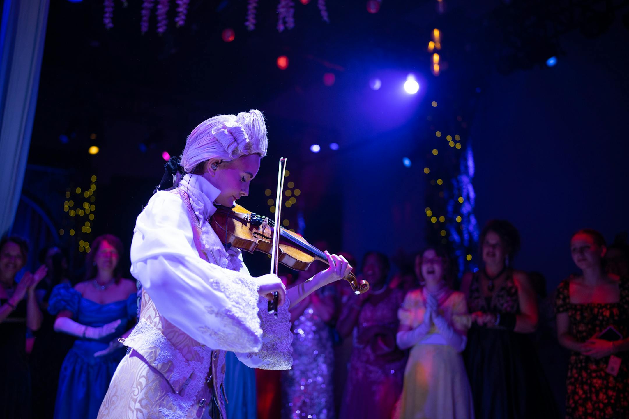 One of the court musicians performed a solo on opening night of The Queen's Ball: A Bridgerton Experience.