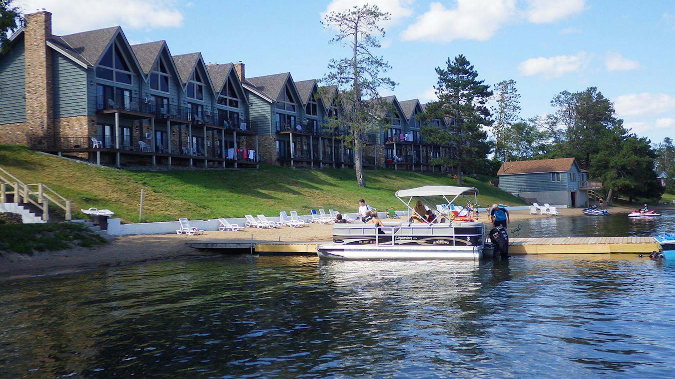 The beach and marina stay busy near Madden's aptly named Sunrise Villas on Gull Lake.