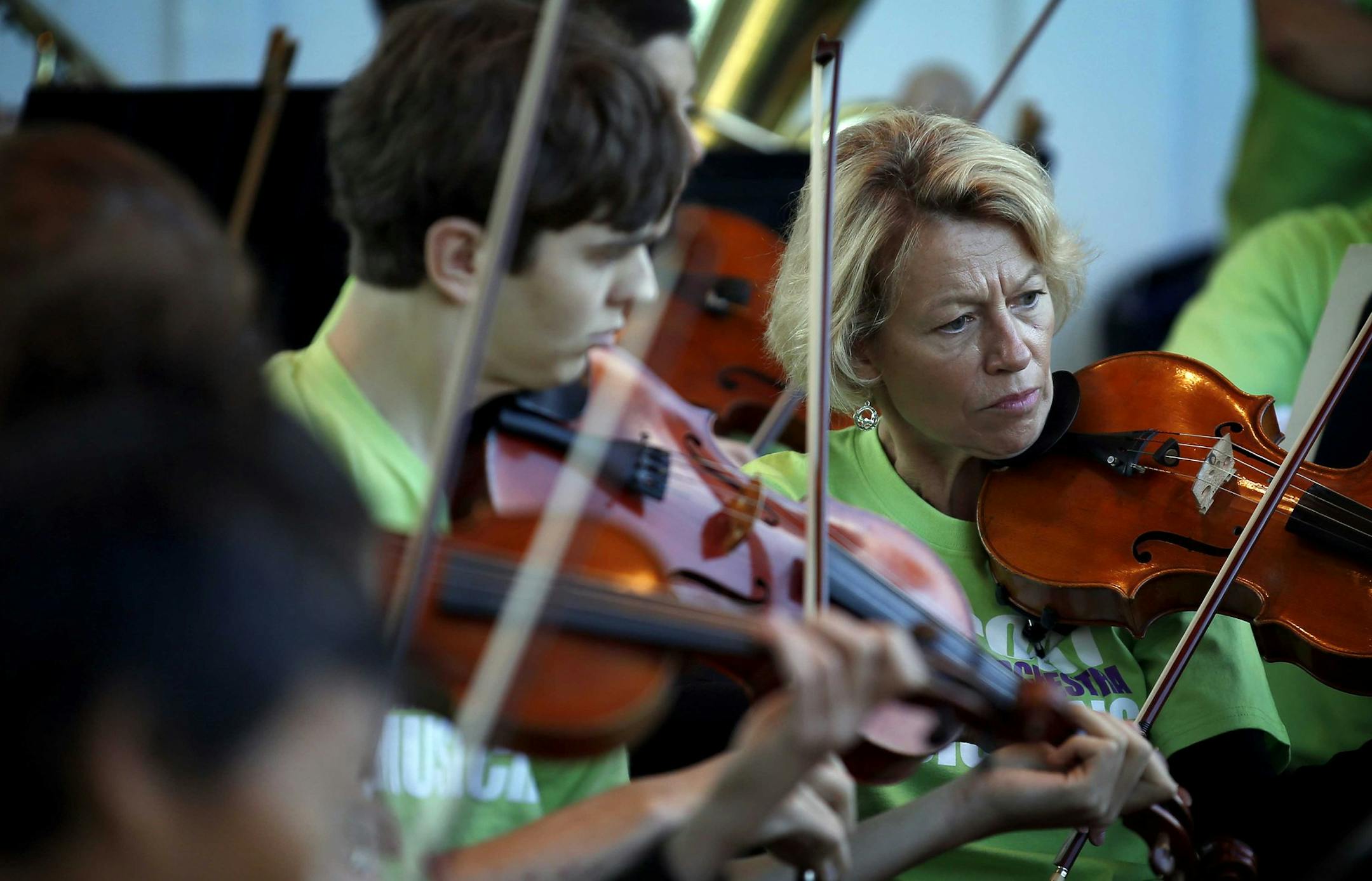 Orchestra musicians played to the Lake Harriet crowd on Sunday, the same day the orchestra board issued a revised proposal in the labor dispute.