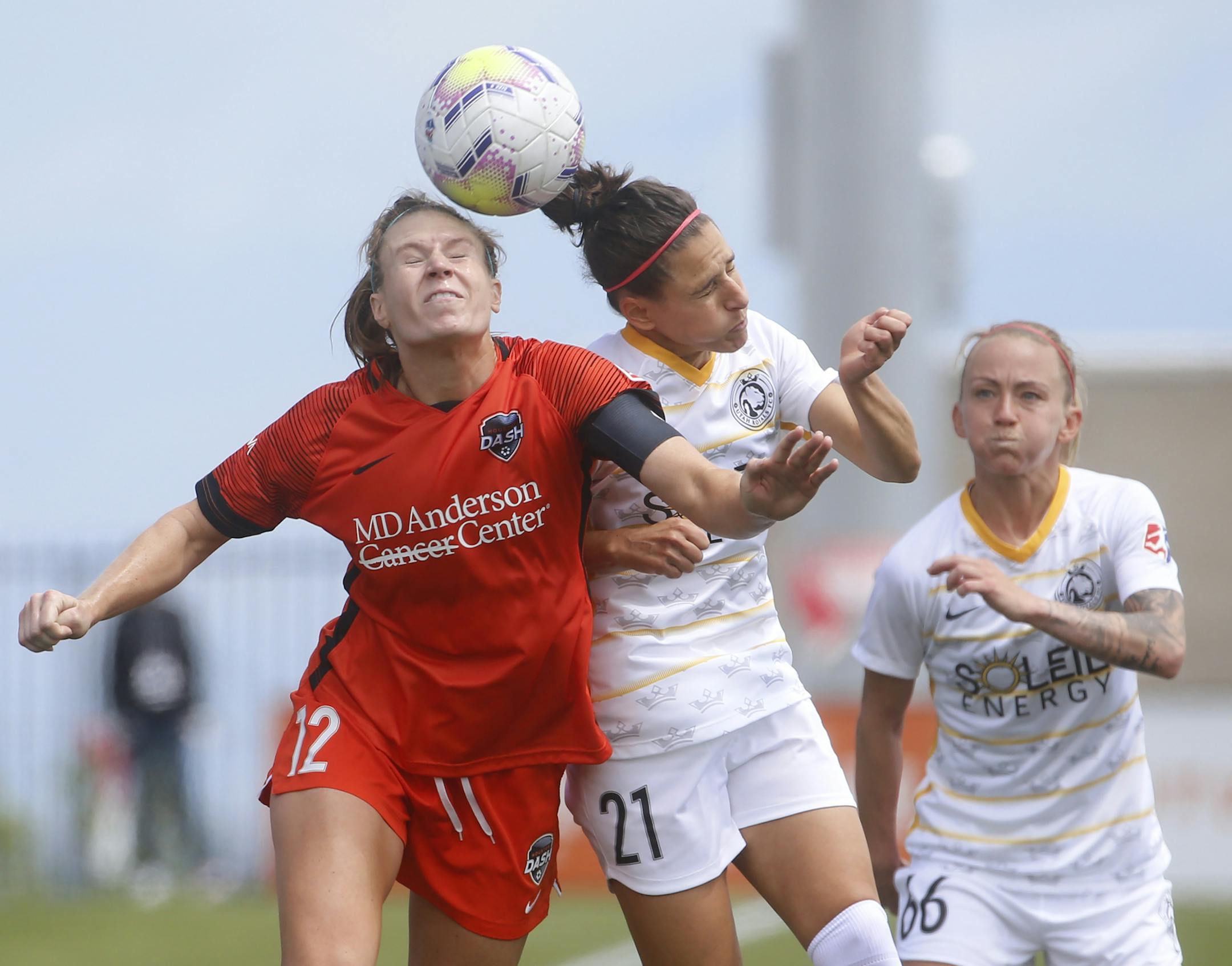 Houston Dash forward Veronica Latsko (12) and Utah Royals FC midfielder Vero Boquete (21) battle for the ball during the second half of an NWSL Challenge Cup soccer match at Zions Bank Stadium Tuesday, June 30, 2020, in Herriman, Utah. (AP Photo/Rick Bowmer)