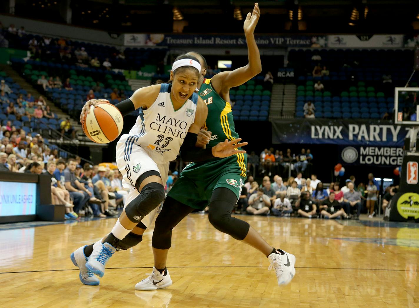 Lynx Maya Moore drove to the basket defended by Seattle's Jewell Loyd during the first half. ] (KYNDELL HARKNESS/STAR TRIBUNE) kyndell.harkness@startribune.com Lynx vs Seattle at Target Center in Minneapolis, Min., Friday, July 3, 2015.