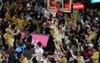 Wake Forest's Cameron Hildreth drives to the basket as fans storm the court at the end of Saturday's game against Duke.